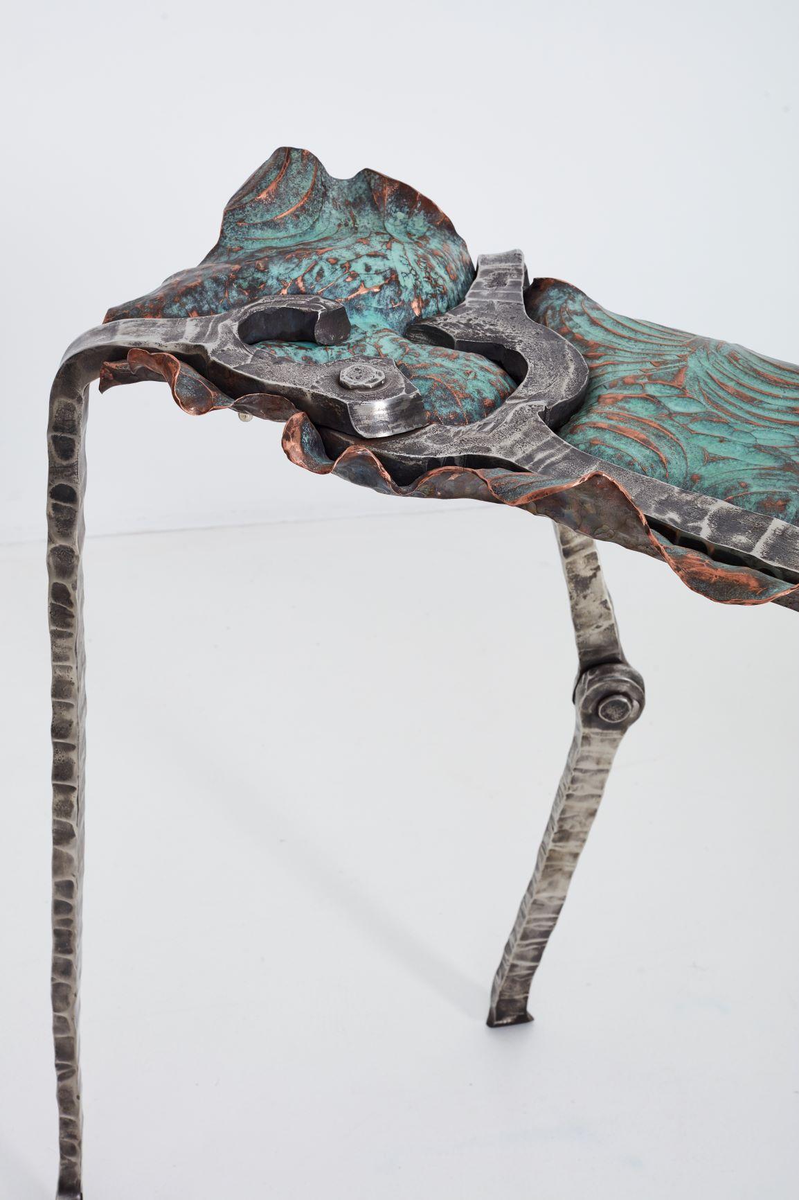 Conrad Hicks is an artist, blacksmith and tool-maker in Cape Town. He specialises in hand forged metal work, using only traditional blacksmithing jointing methods as he believes these are essential to the symbolic meaning of the finished form. He