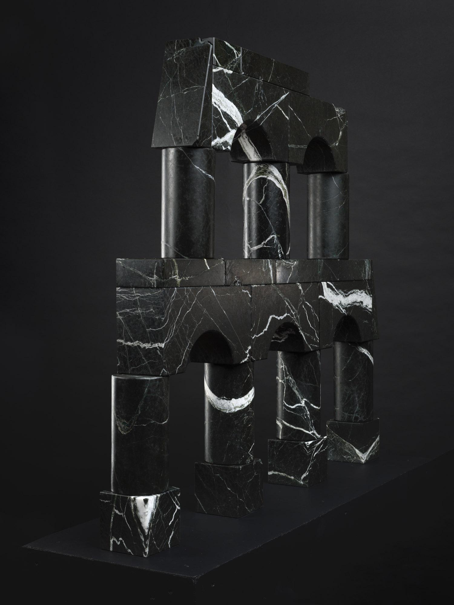 ‘Verde Levanto’ building blocks
Black paper and white paint 

The blocks have been cut and sanded into 7 different basic shapes, based on wooden toy blocks. They are not affixed in any way, but placed on top of each other in a specific building