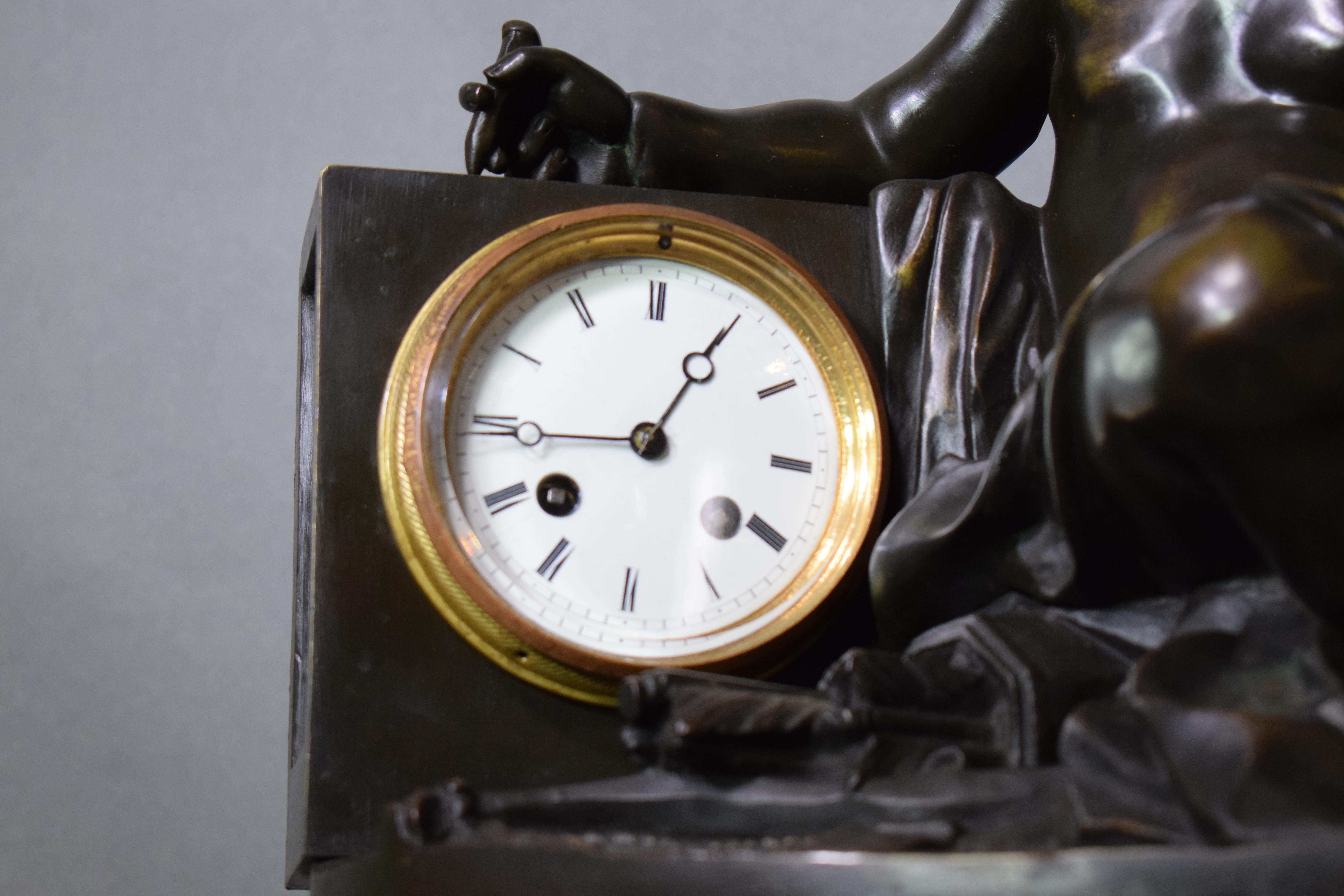 A magnificent bronze clock depicting a resting Cupid For Sale 2