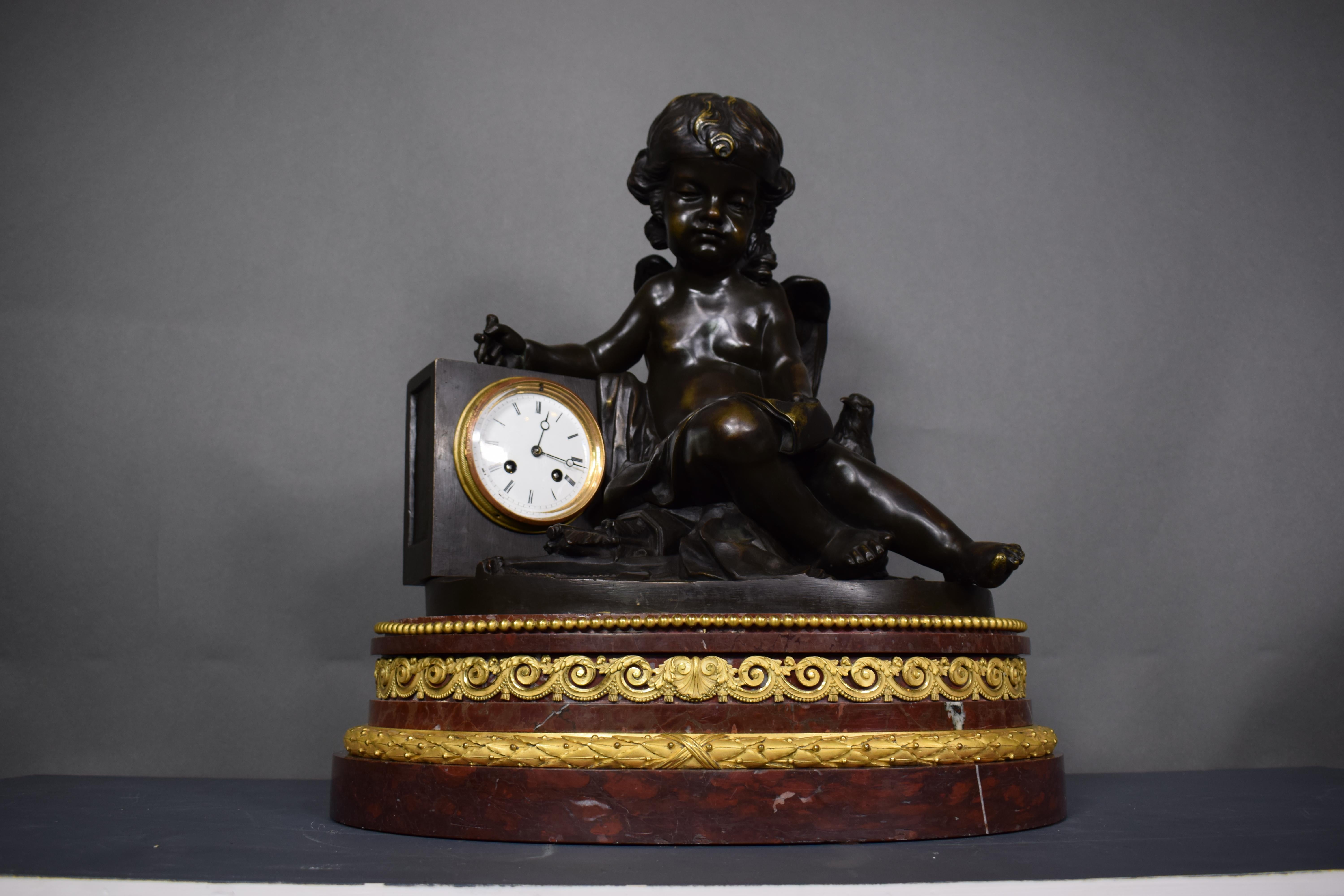 A magnificent bronze clock depicting a resting Cupid For Sale 10
