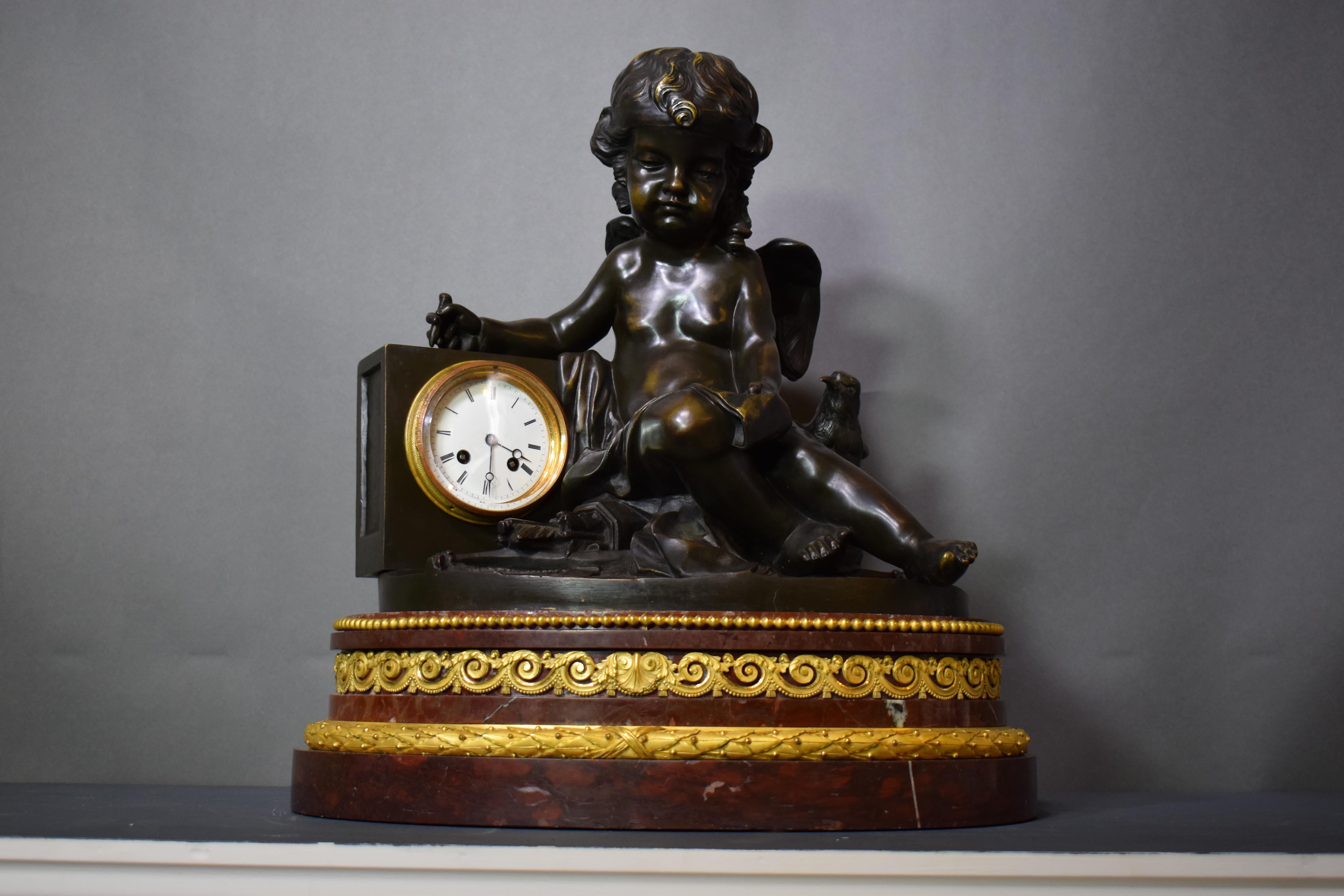 A magnificent bronze clock depicting a resting Cupid For Sale 11