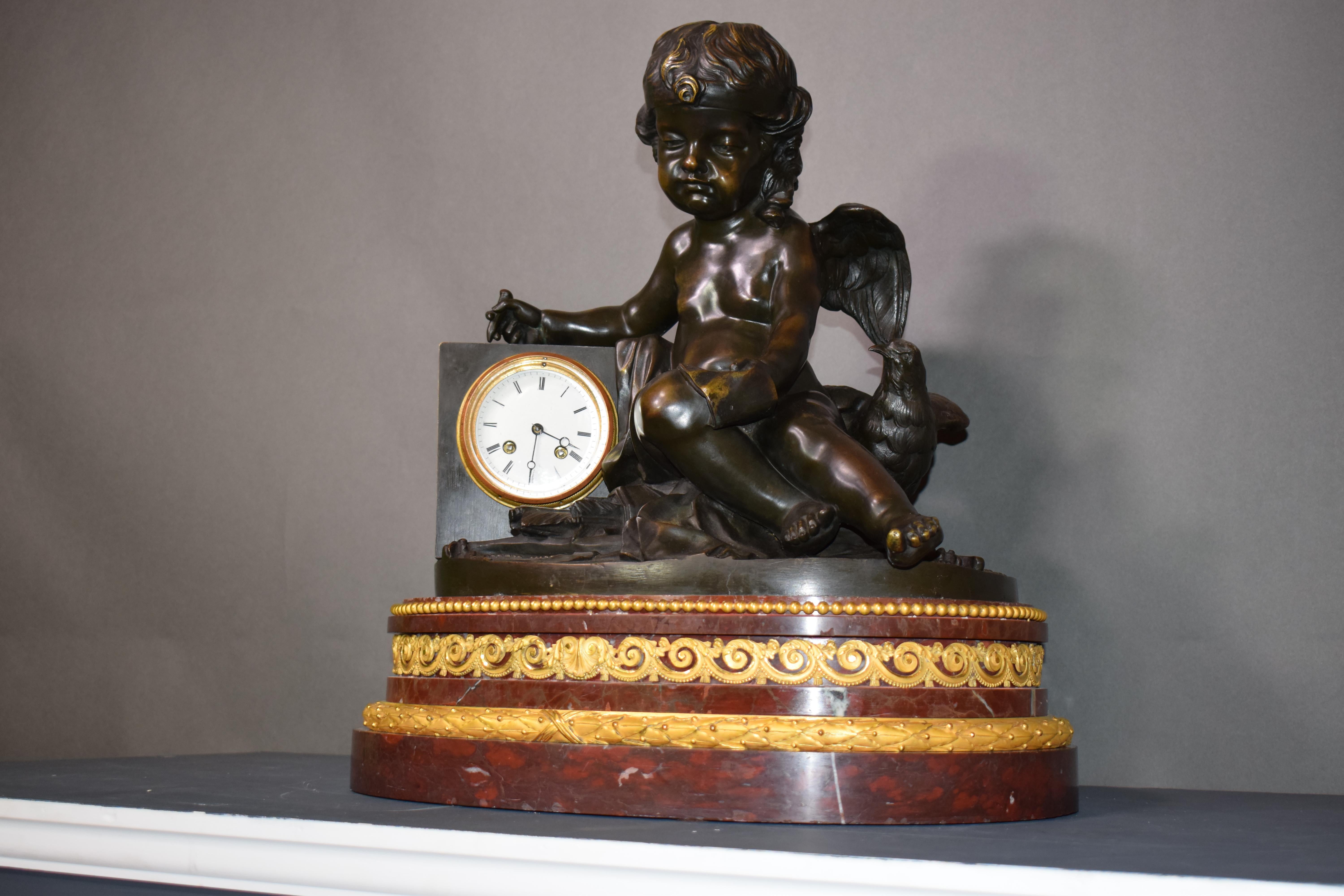 A magnificent bronze clock depicting a resting Cupid For Sale 12