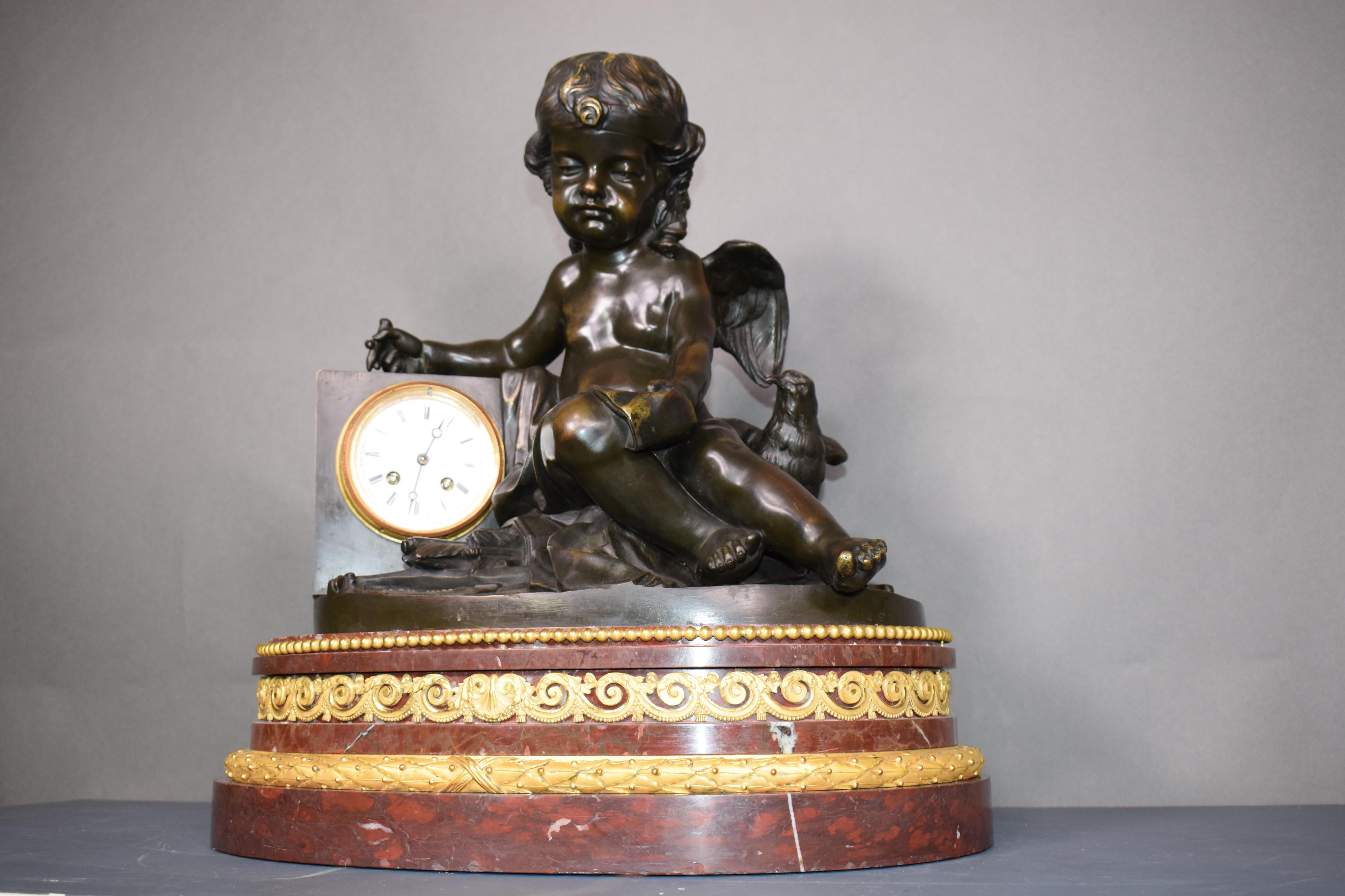 A magnificent bronze clock depicting a resting Cupid In Good Condition For Sale In Atlanta, GA