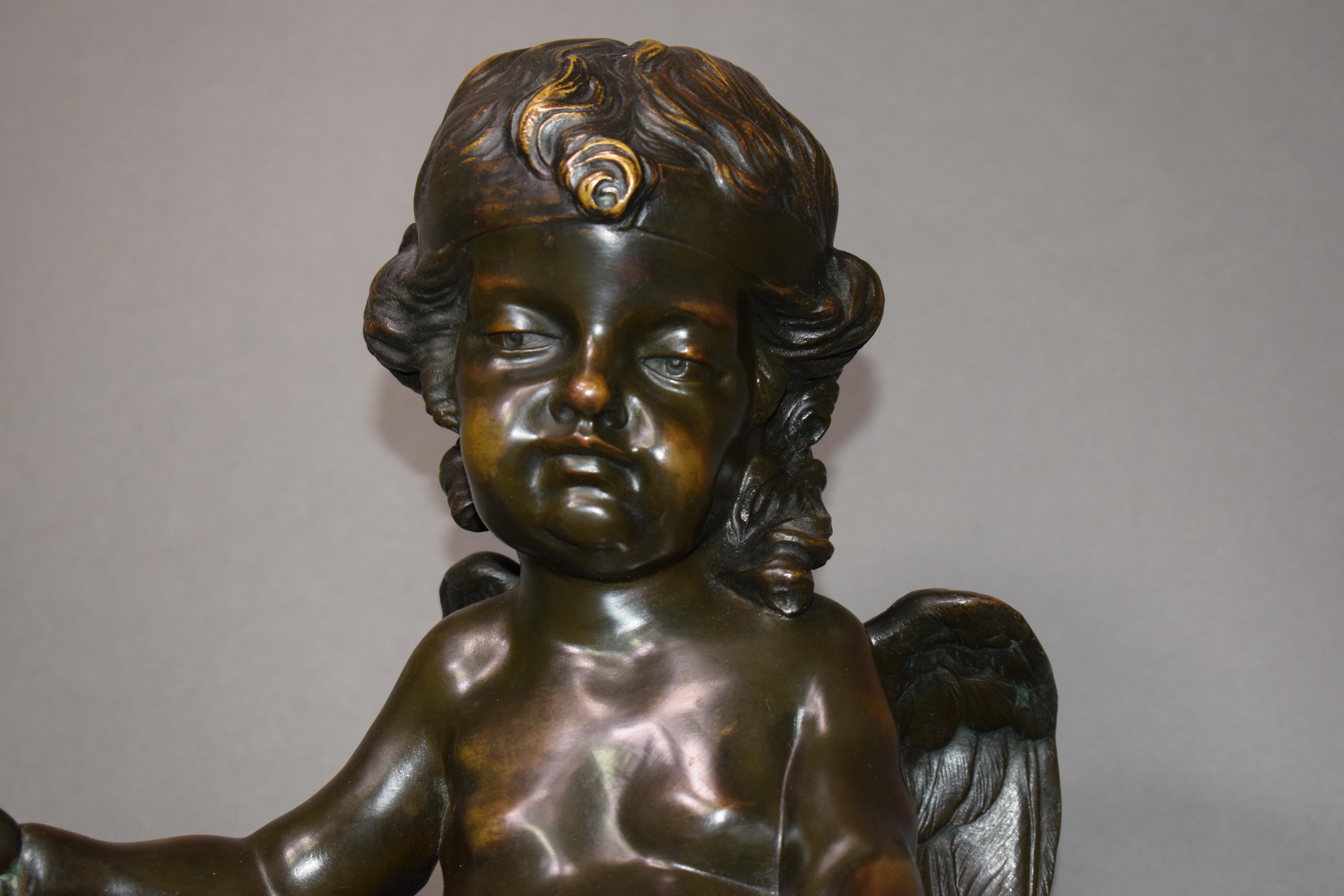 Marble A magnificent bronze clock depicting a resting Cupid For Sale