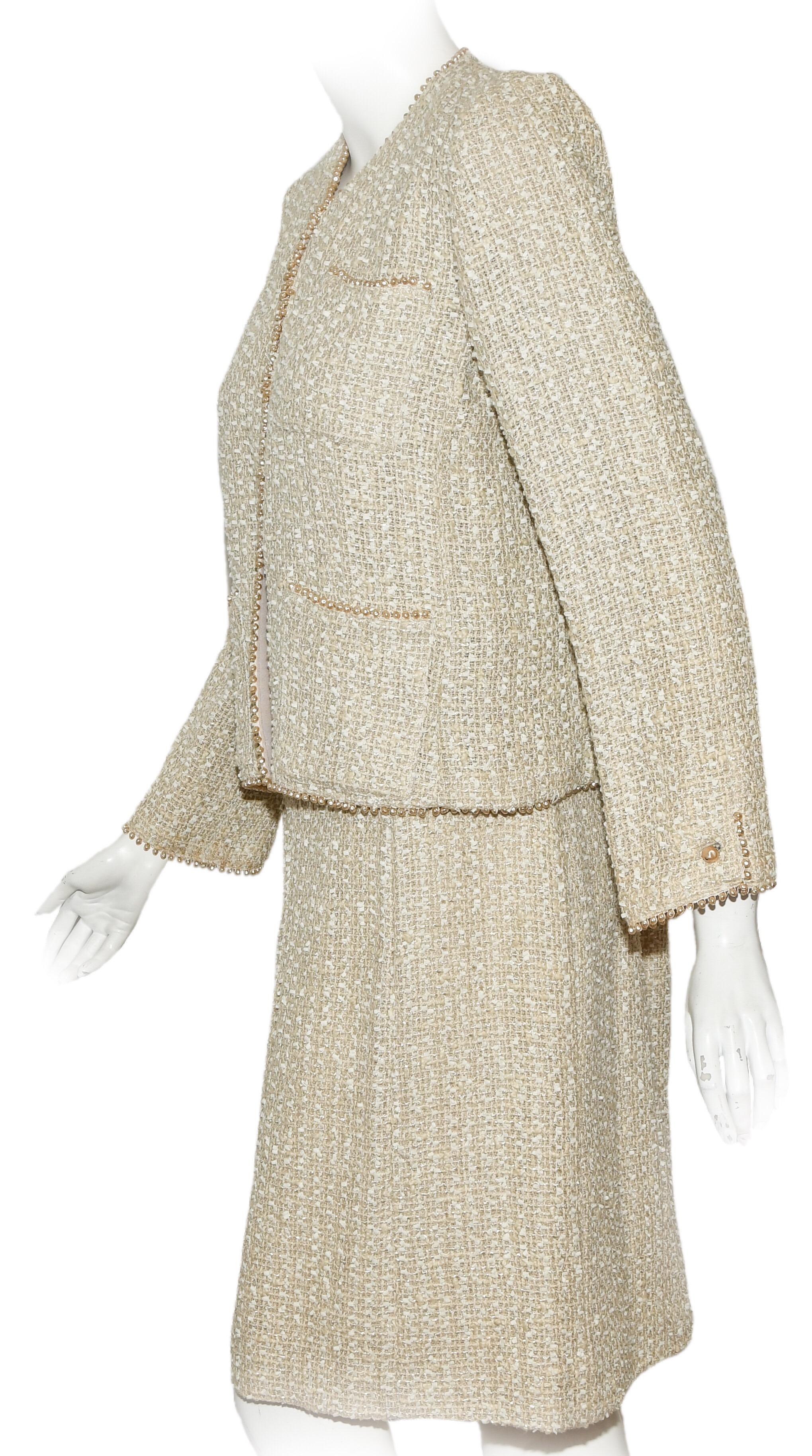Chanel nacar beige skirt suit from the Spring 1999 collection was very appropriate for the season, even a bit beachy,  bringing in the pearls!  Chanel's boucle dinner suit is trimmed in blush freshwater pearls along the cuffs that are accentuated