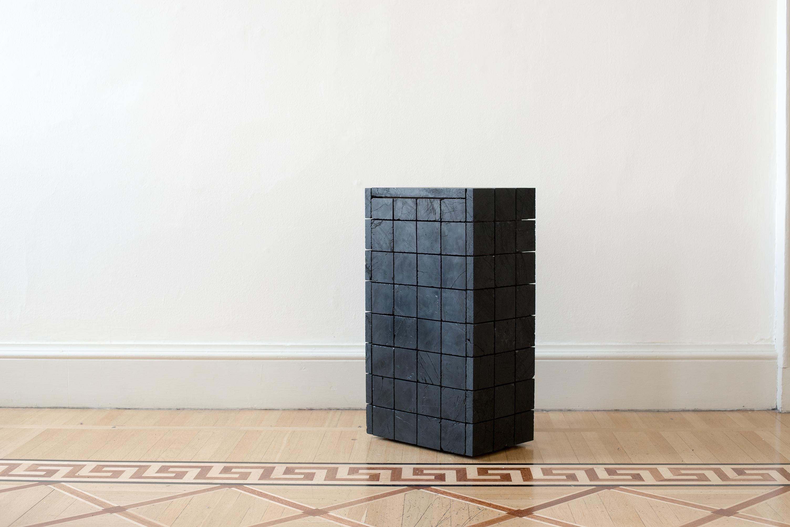 Console 018 by Jesper Eriksson
Dimensions: D 42.9 x W 27.9 x H 76.1 cm 
Materials: anthracite coal, wood frame
Weight: 60 kg

Jesper Eriksson (b.1990, Paris) is an artist & designer based in London, interested in work related to the human,