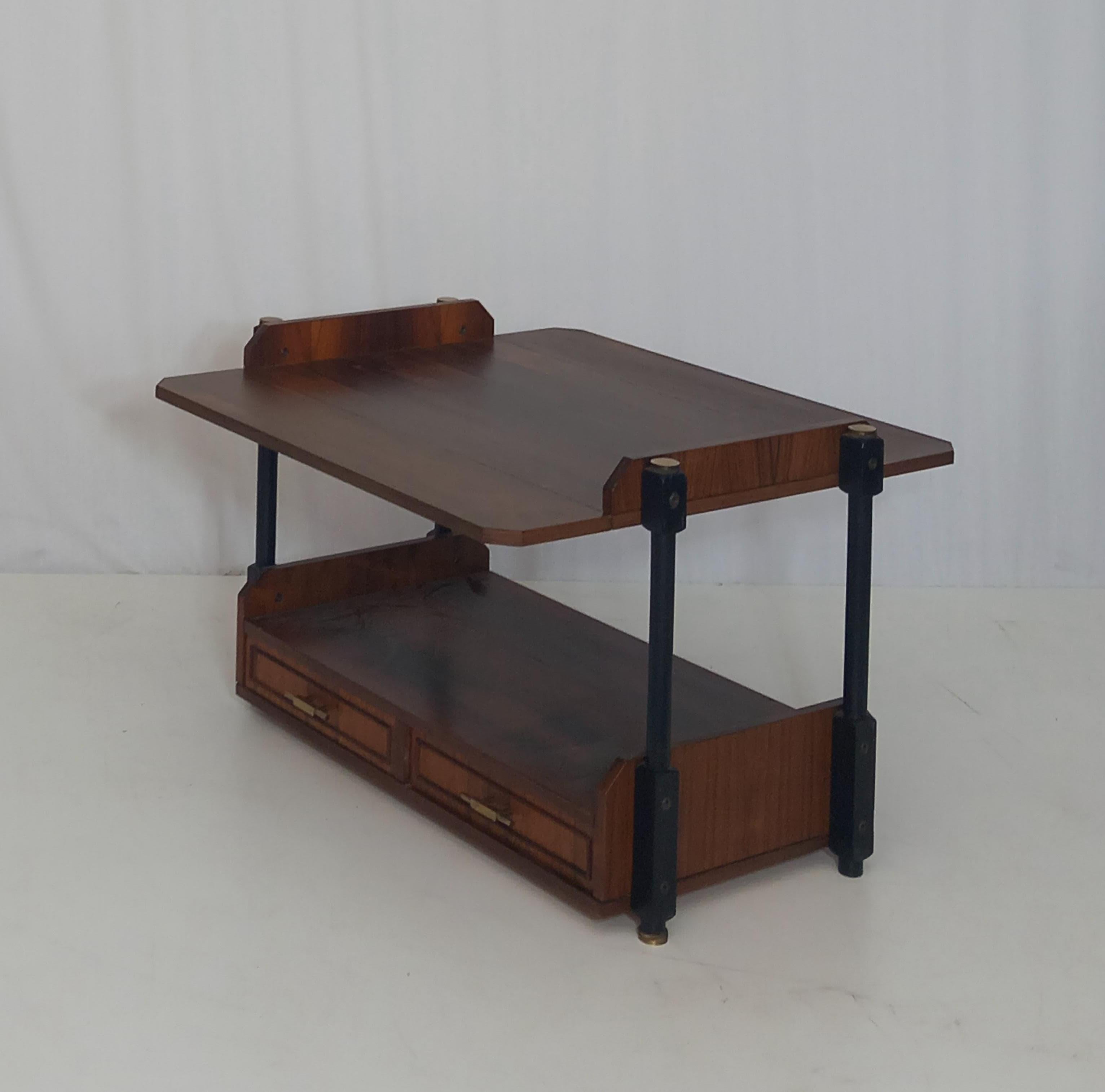 Introducing a mid-century console displaying the iconic design aesthetics from the 60s. Crafted from high-quality wood, this classic piece showcases simplicity and minimalism through its clean, simple lines. This piece of furniture adds a touch of