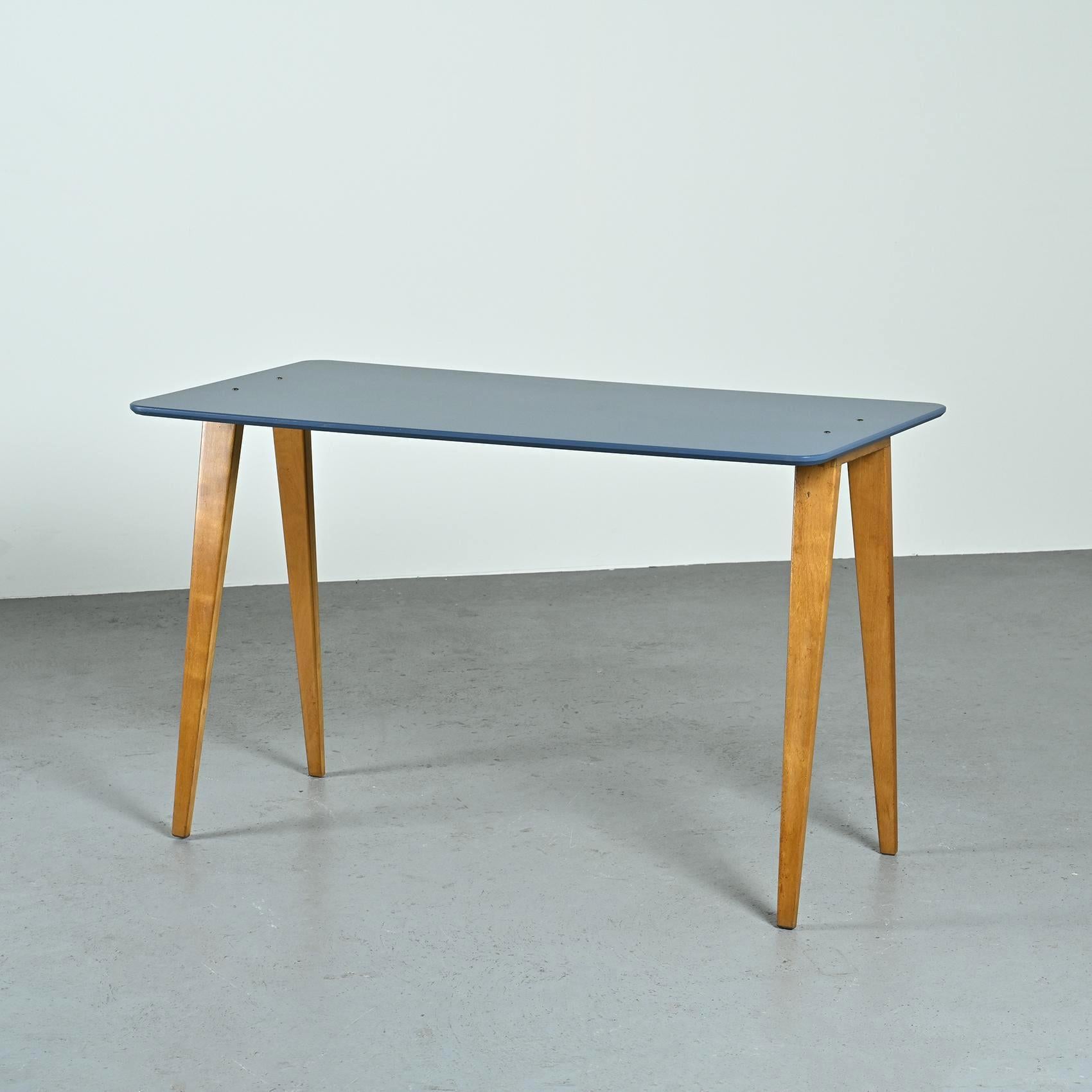 Desk or console by the cabinetmaker and designer from Lyon, André Sornay.

It is composed of an inverted U-shaped base mounted in straight tails on which rests a blue lacquered ash top which has been restored. Its versatile design allows it to be
