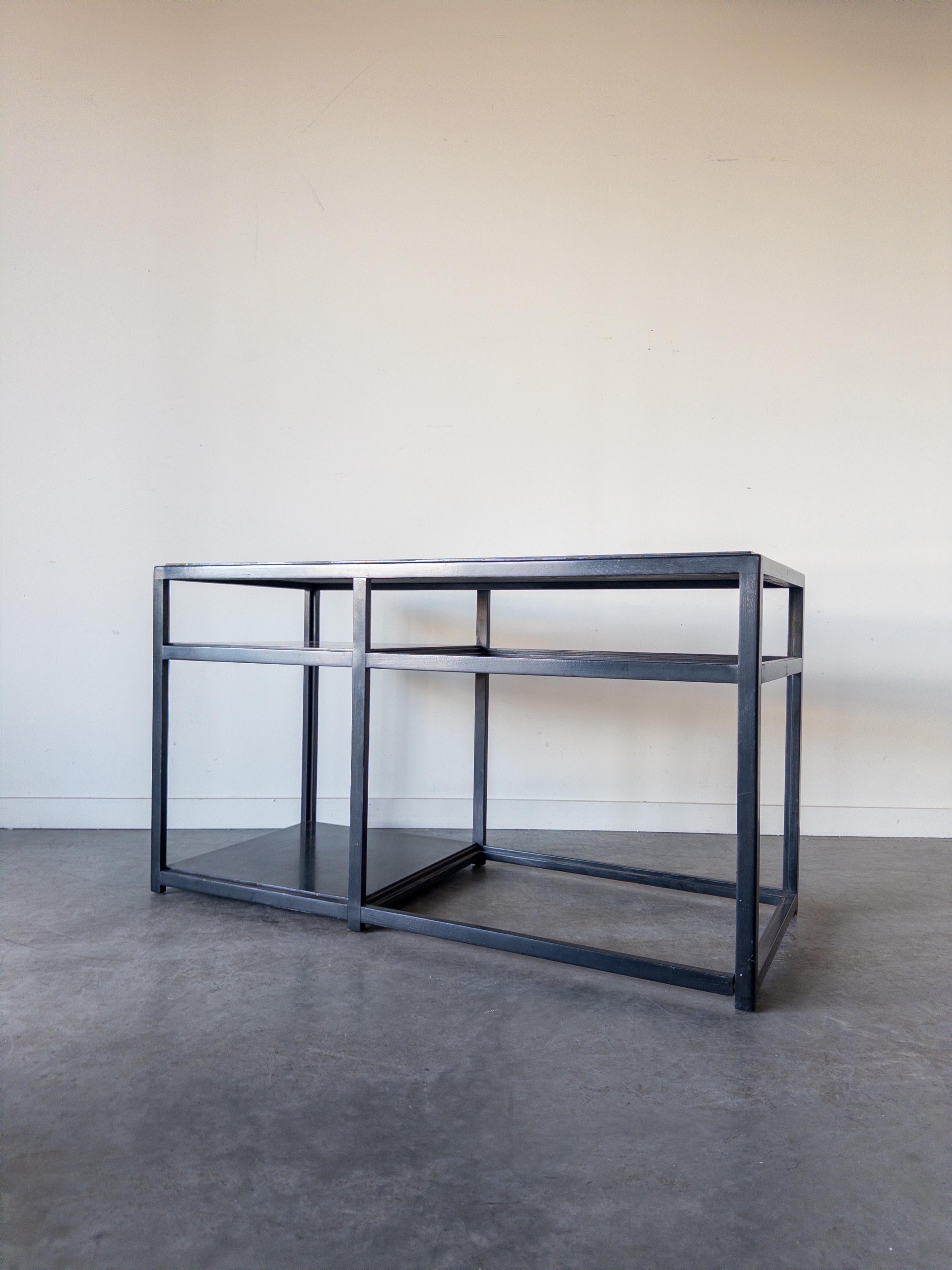 Architectural Console No. 5403 in dark walnut with black laminate top and shelves designed by Edward Wormley for Dunbar, 1950s. Retains original DUNBAR labels.

