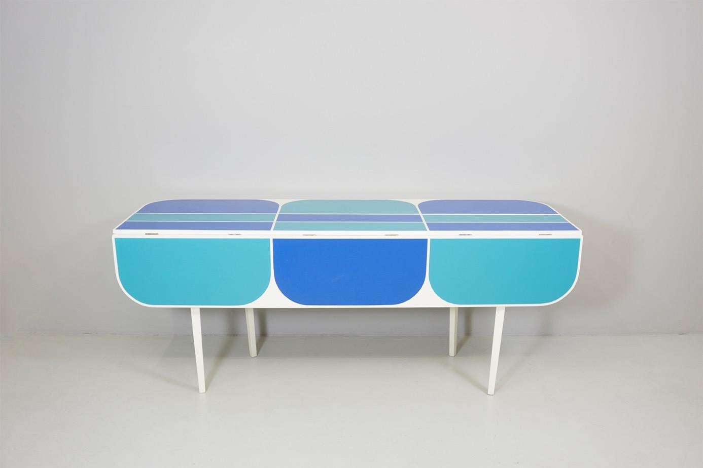 Console from 'Apta' series
white coated wood, color fields, extendable
Dimensions / L.185 cm W.86 cm H.74 cm
Design / Gio Ponti 1970
Width depends on how much the table is folded out: 30 / 58 / 86cm
Legs adjust with extension of the