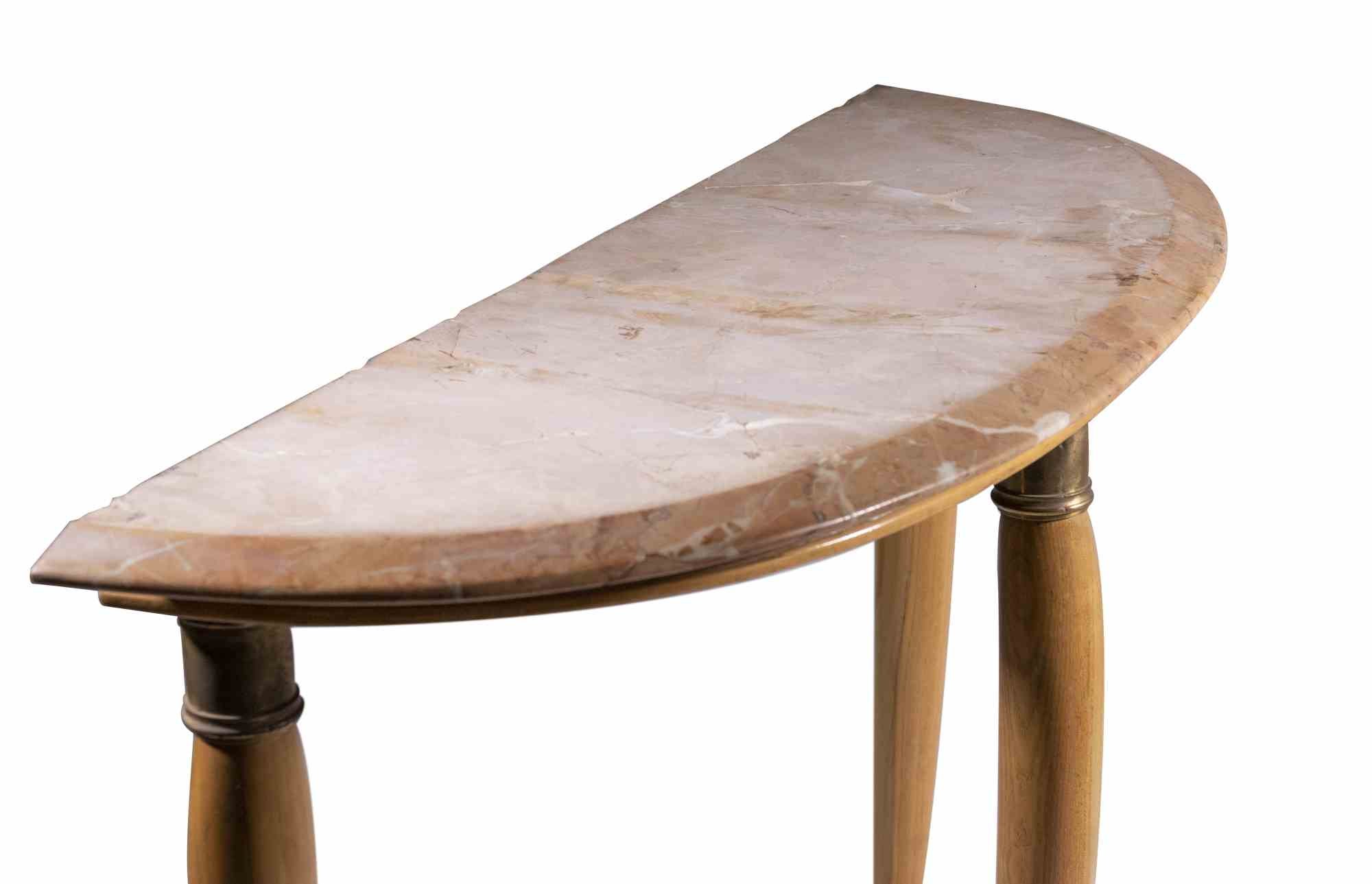 Consolle is an original design furniture item attributed to Paolo Buffa and realized in the 1950s.

A vintage wooden consolle with marble top.

Mint conditions (some lack on the marble top).