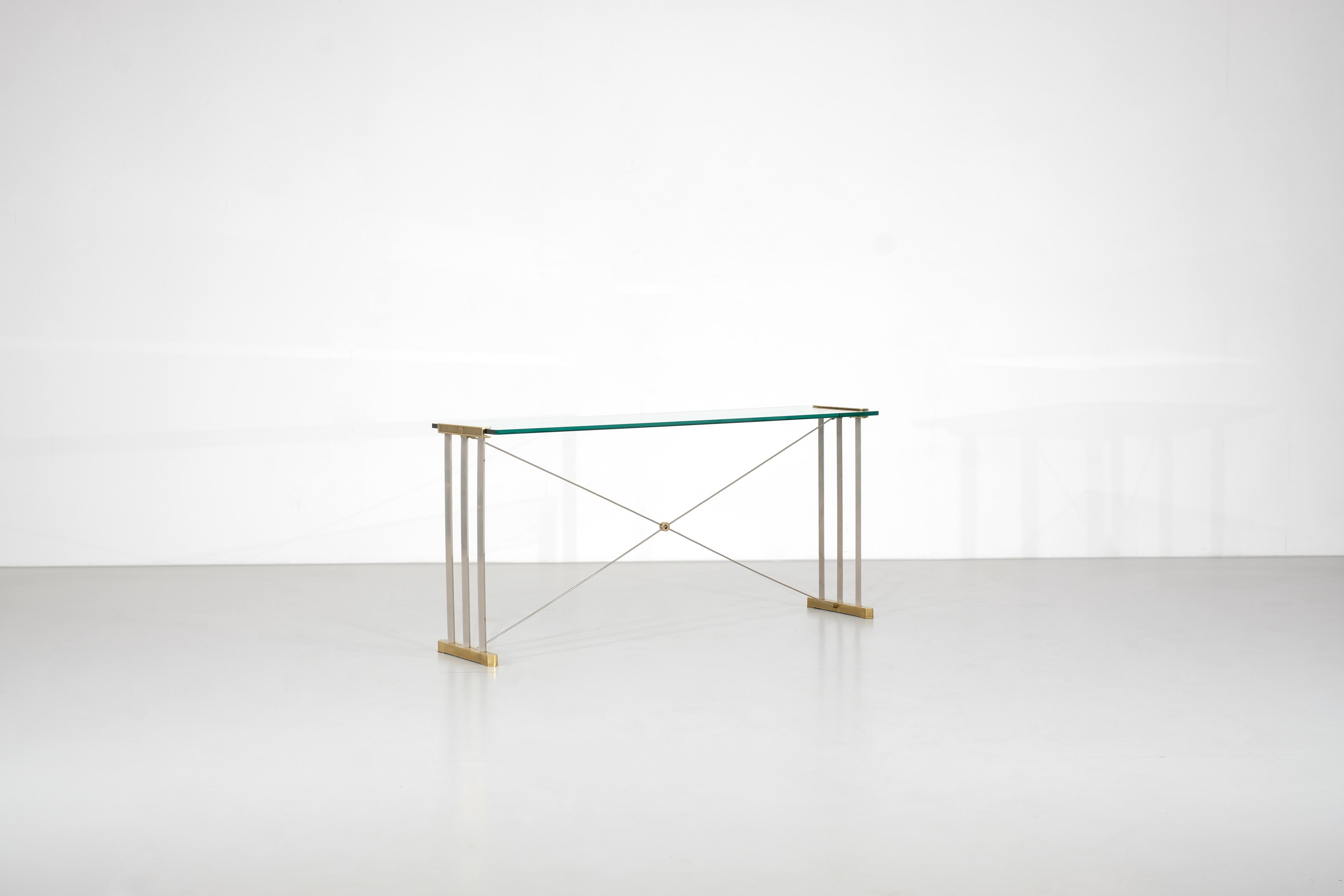 Console Table in Brass and metal with glass top.
By Peter Ghyczy for Ghyczy, Holland, 1970s.

 

 

Designer - Peter Ghyczy.

Producer - Ghyczy.

Production period - 1980s.

Measures - Width 152 cm x Depth 40 cm x Height 72 cm.

Materials - Brass,