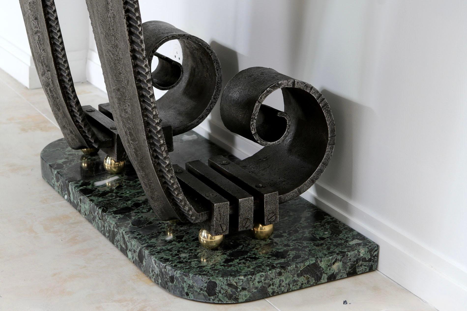 This console features a rare, handcrafted console table by Raymond Subes from 1930, showcasing the elegance and mastery of wrought iron (fer forgé) design. Subes, a celebrated French designer, was known for merging artistic craftsmanship with
