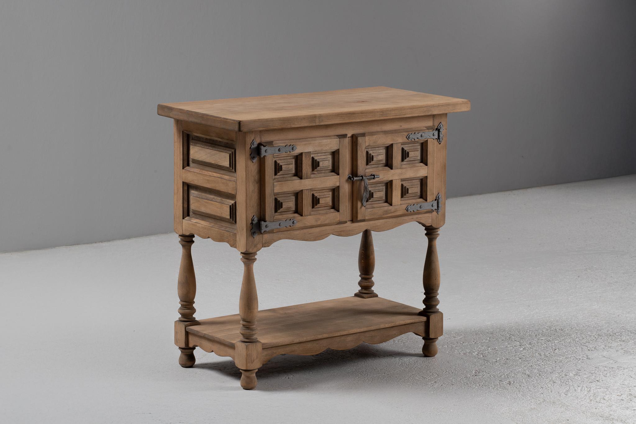 Spanish Colonial Console Cabinet in Carved Elm with Turned Legs and Iron Latch, Spain, 1940s For Sale