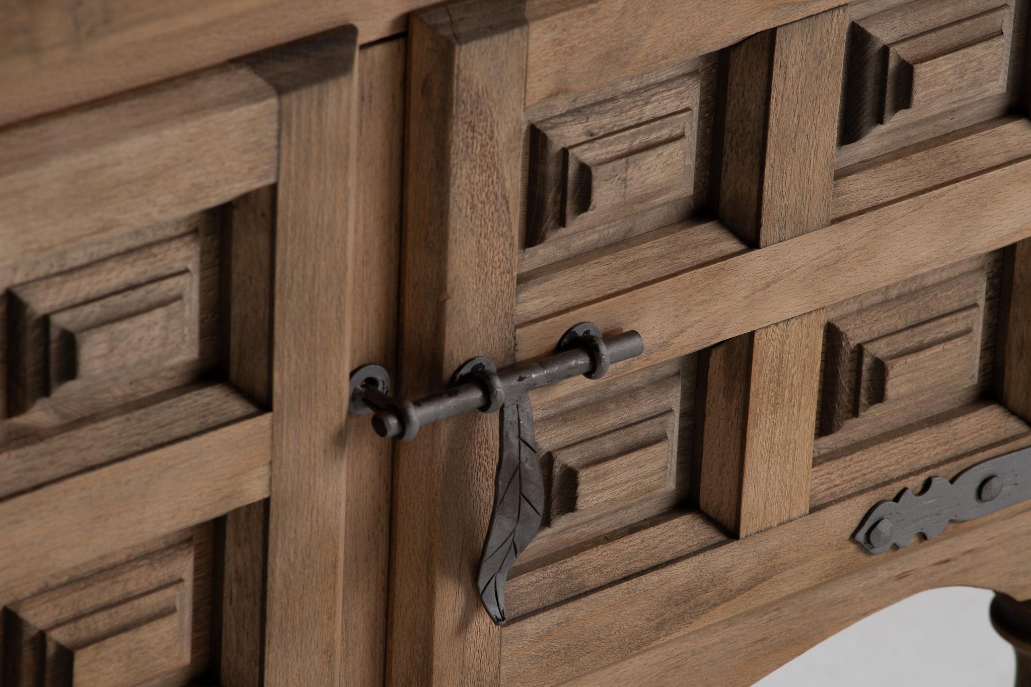 Spanish Console Cabinet in Carved Elm with Turned Legs and Iron Latch, Spain, 1940s For Sale