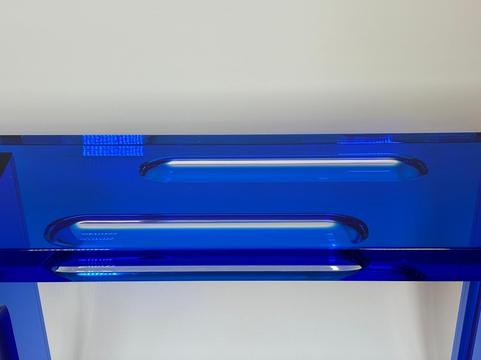 Console Deep Blue model in blue plexiglass designed by Studio Superego for Superego Editions.

Biography
Superego editions was born in 2006, performing a constant activity of research in decorative arts by offering both contemporary and vintage