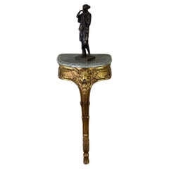Consola D'entre-deux, estilo Luis XV en madera tallada y dorada, hacia 1900