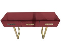 Konsole für das Wohnzimmer, rotes Spiegel-Muranoglas, Griffe und Füße aus Messing