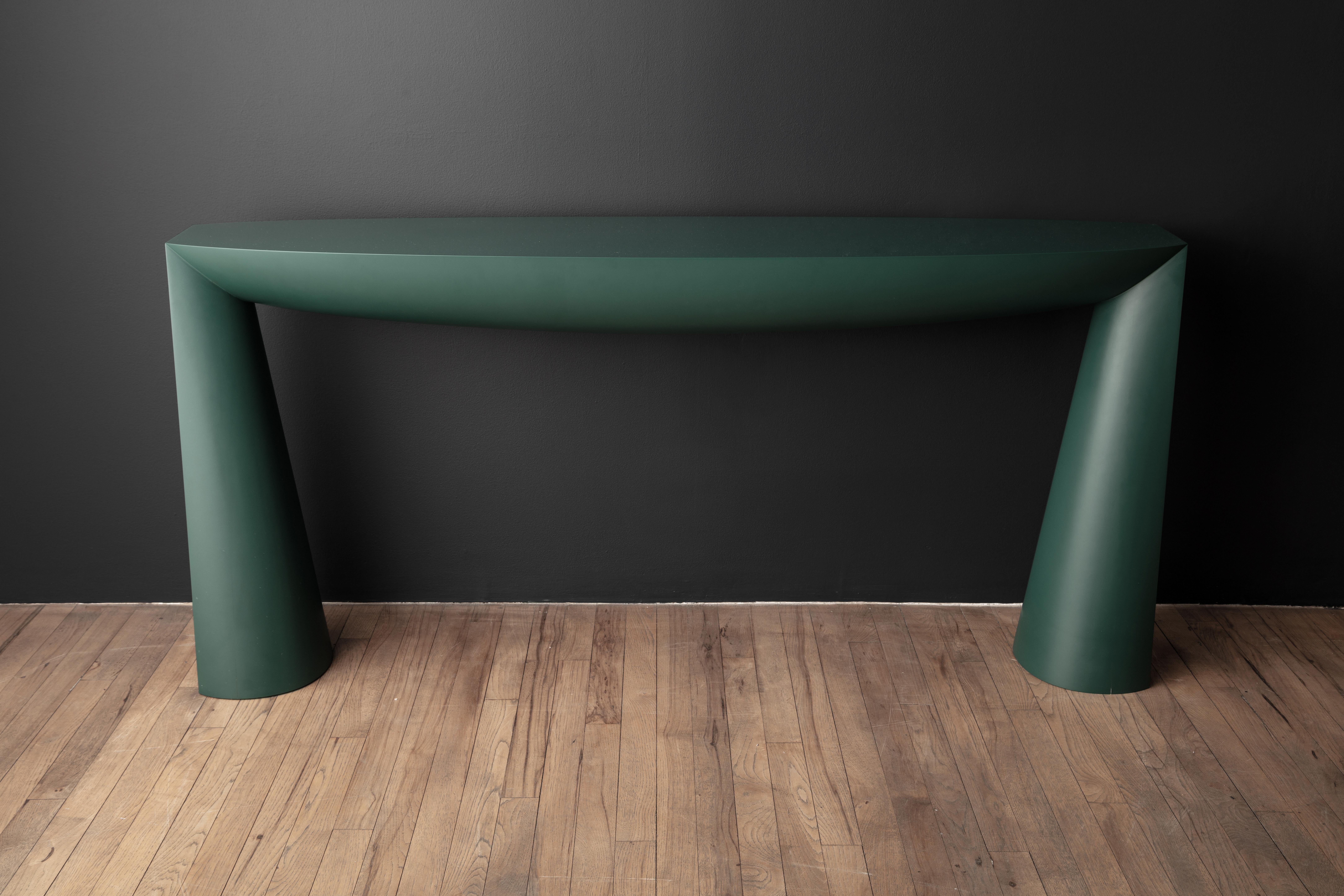 First exhibited at the Galerie Vidid in Rotterdam, the Console table of Aldo Bakker depicts the simplest design concept of a table: two legs and a surface. The legs are an elongation of the line created by the tabletop. The tabletop and the base of
