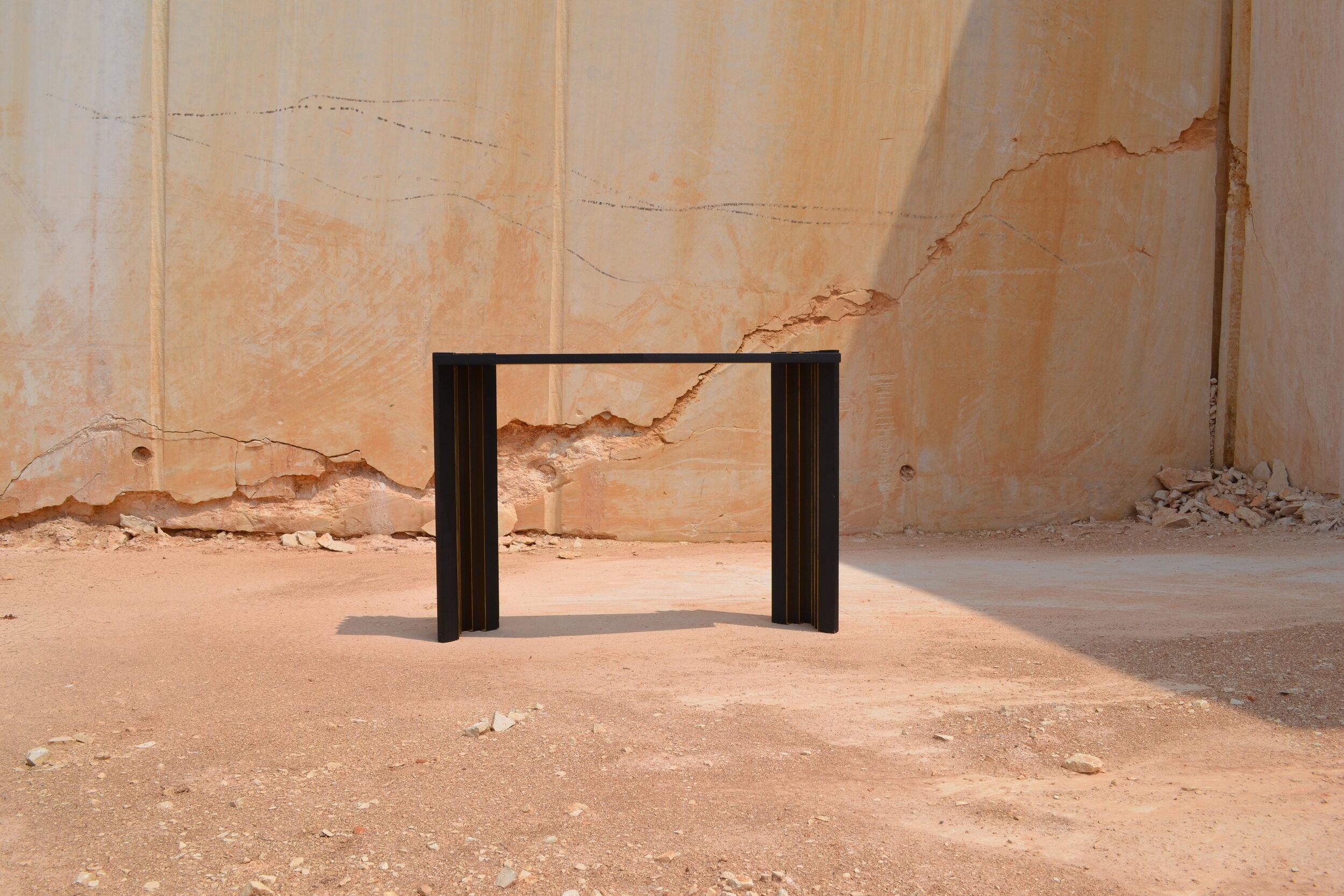 Console I in black is made out of solid oak wood, matte blackened and polished brass. 
A sculptural approach to furniture with bold geometry, solid materials and elegant colours. 

Desia • Ava (b.1991) is a Bulgarian-born visual artist based in