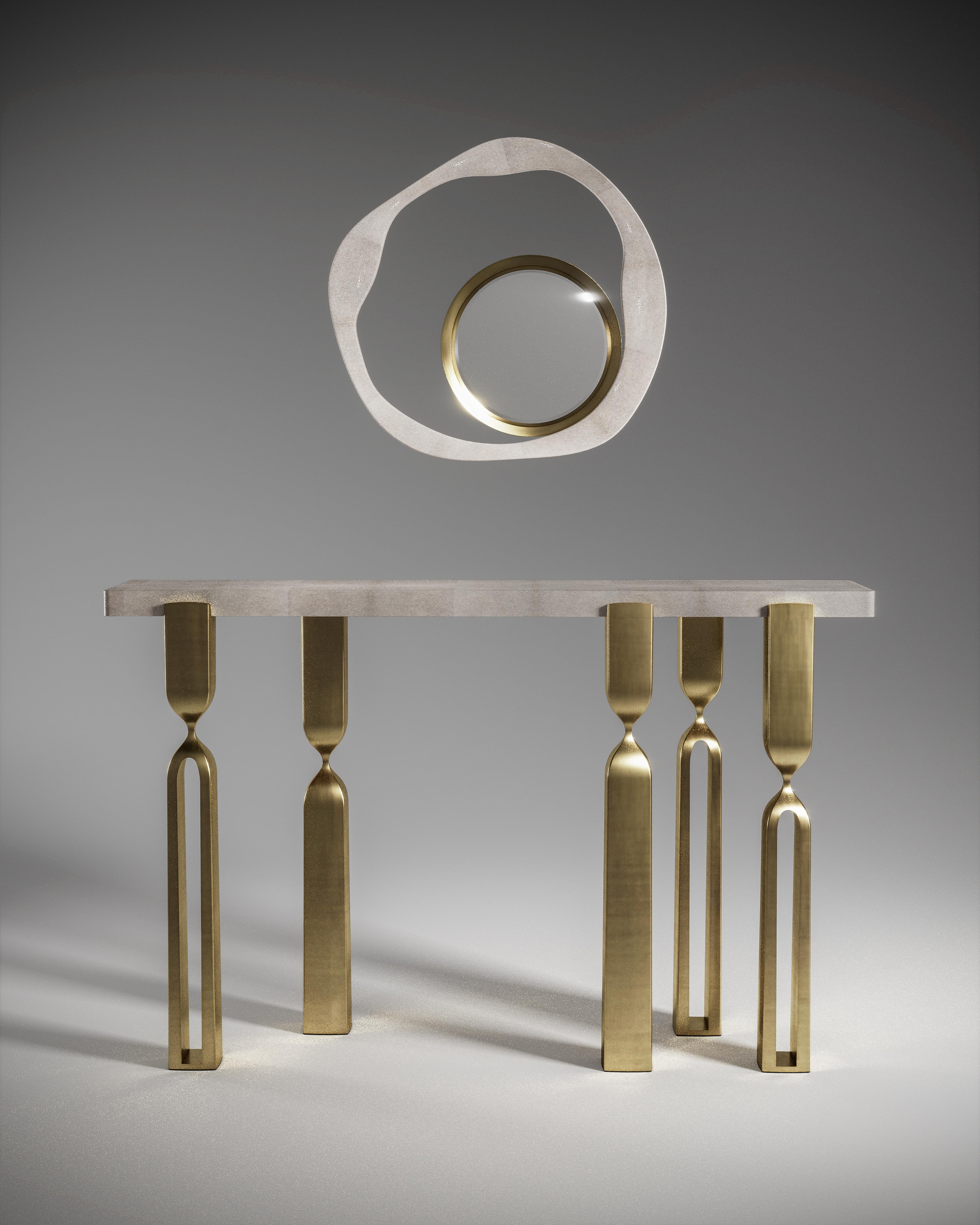 Inspired by the original Rhapsody lamp, by her fiancee Patrick Coard Paris, Kifu Paris designs a sculptural console as an ode to his iconic lighting collection. The console tabletop is inlaid in coal black shagreen and sits on 5 bronze-patina brass