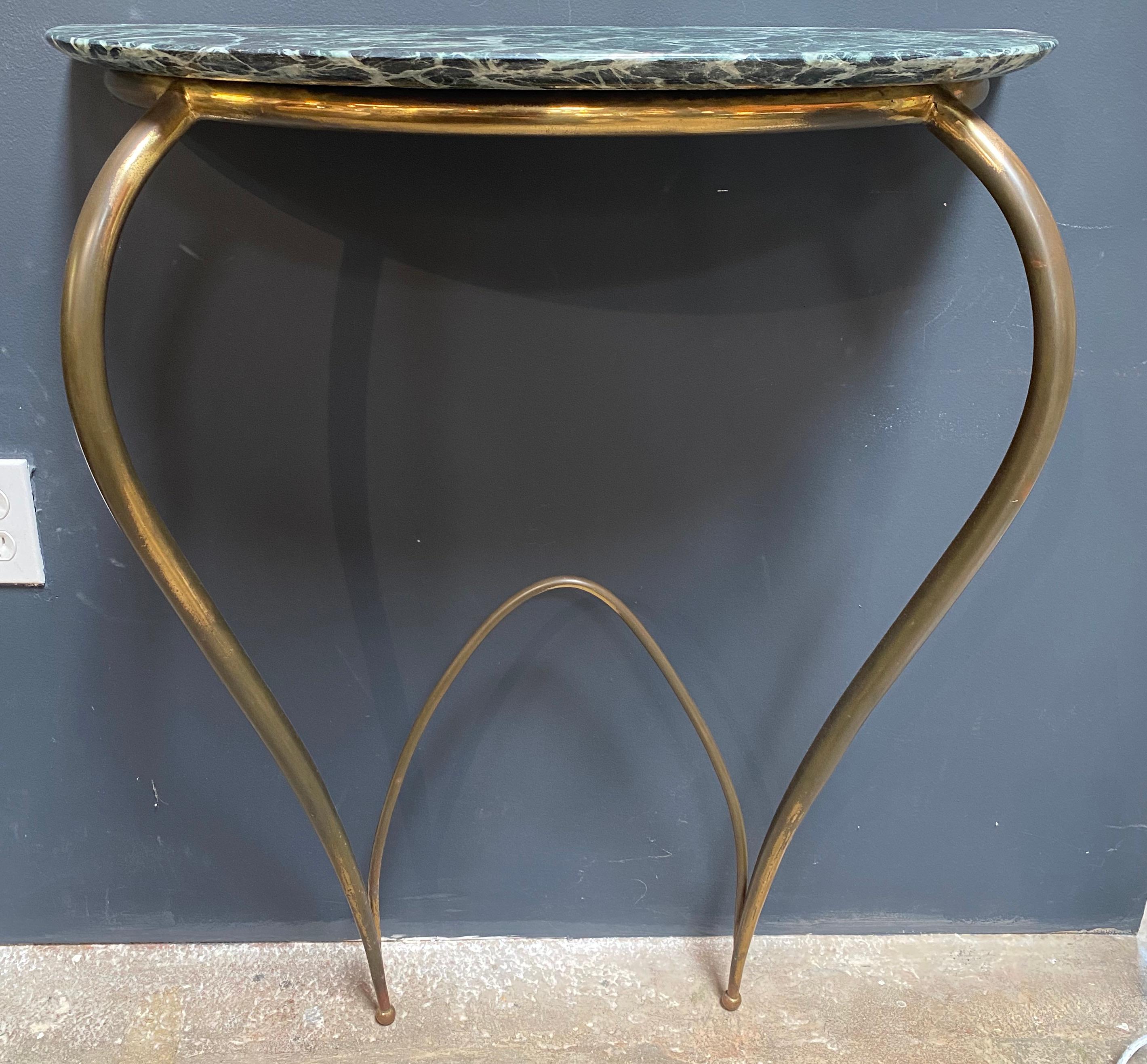 Console in brass and marble attribute to Ico Parisi, Italy, 1950s
Midcentury console with a sloping brass frame and original semi-circular marble top.
The brass has a nice aged patina but can be polished on request.

 