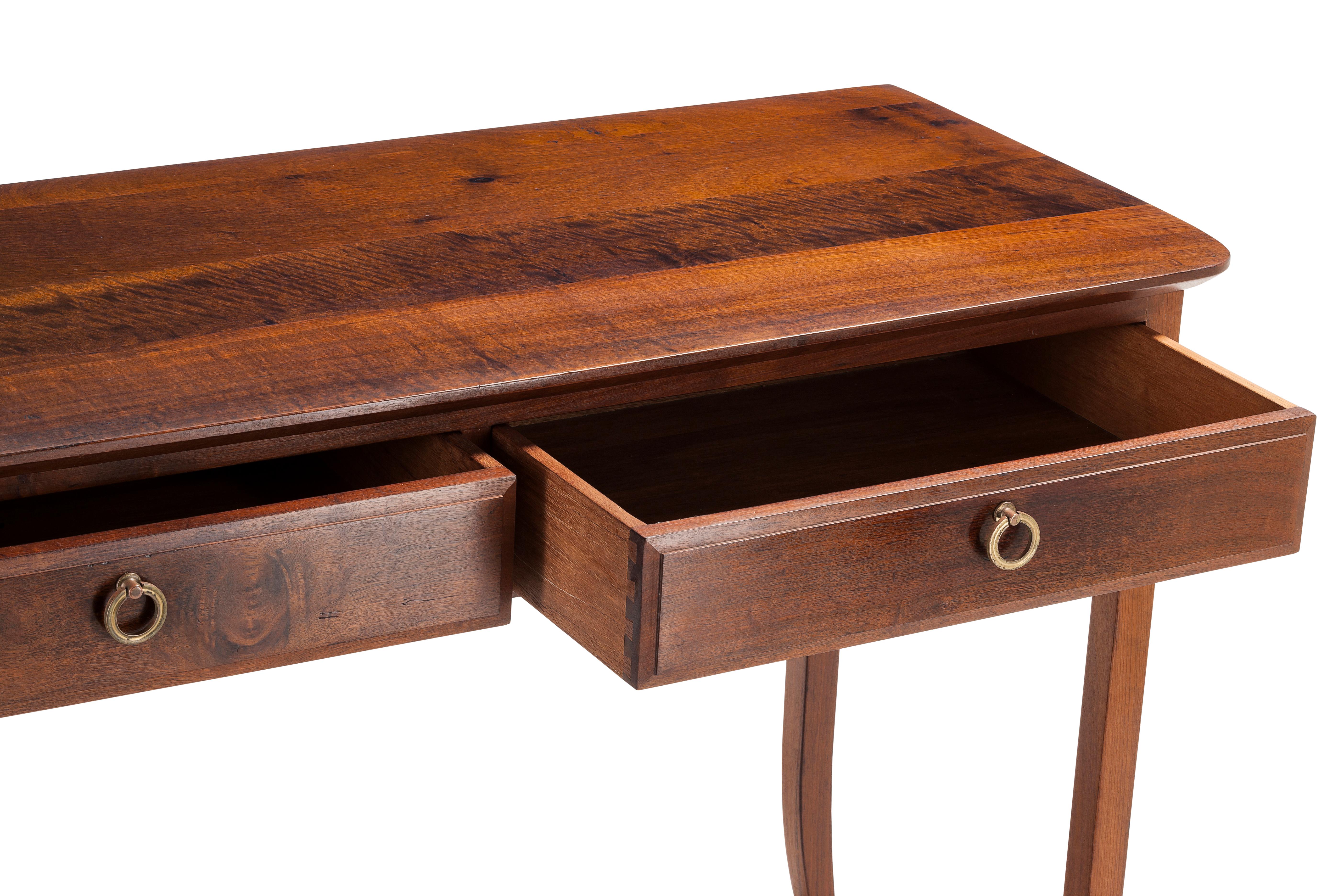 This side table, in solid Brazilian walnut ('Imbuia'), was manufactured in the 1960s for 'Binnehuis', a sought after midcentury Furniture manufacturer in South Africa renowned for their quality furniture in the 1960s-1980s.
The splayed, tapered