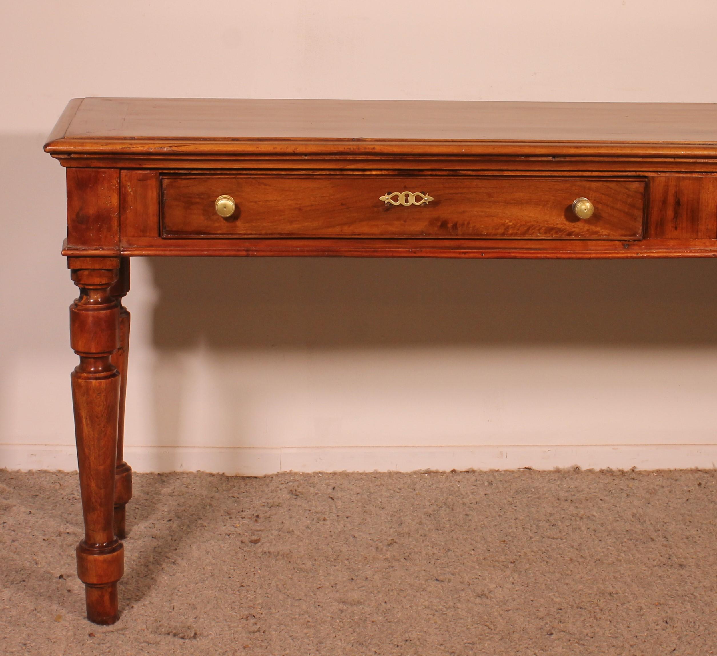 lovely 19th century french cherry wood console with two drawers

Very beautiful double-sided console or server with one side made up of two drawers and the other side worked (not in raw wood)
It is therefore possible to put it against a wall or in
