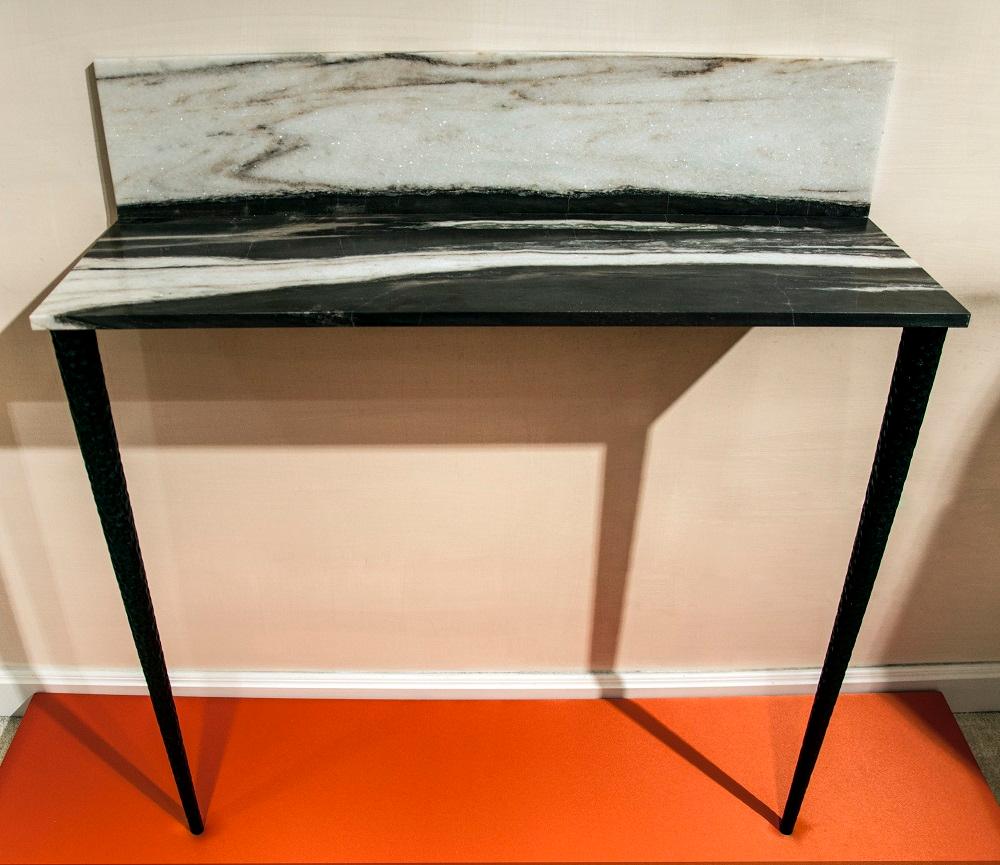 Sospesa is a console in Panda marble and graven wood legs.

Sospesa belongs to the Capsule Collection 2018 by architect Guido Ciompi who designed a collection for Tuscan furniture makers Turini & Werich in collaboration with Fiammetta V Home