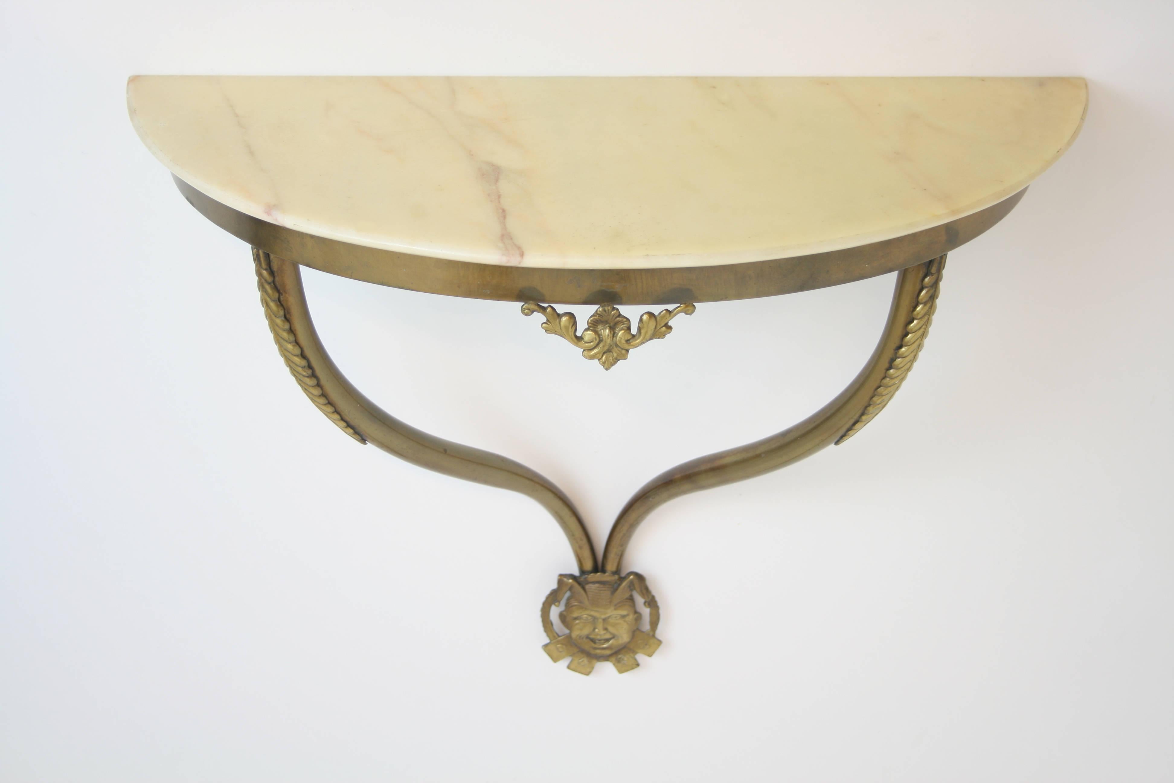 Very rare console with a frame of solid brass and a marble top. Most probably this piece has been part of a facility of a casino in Italy in the early 1950s. Its design language is strongly reminiscent of works by Gio Ponti. An eye-catching relief