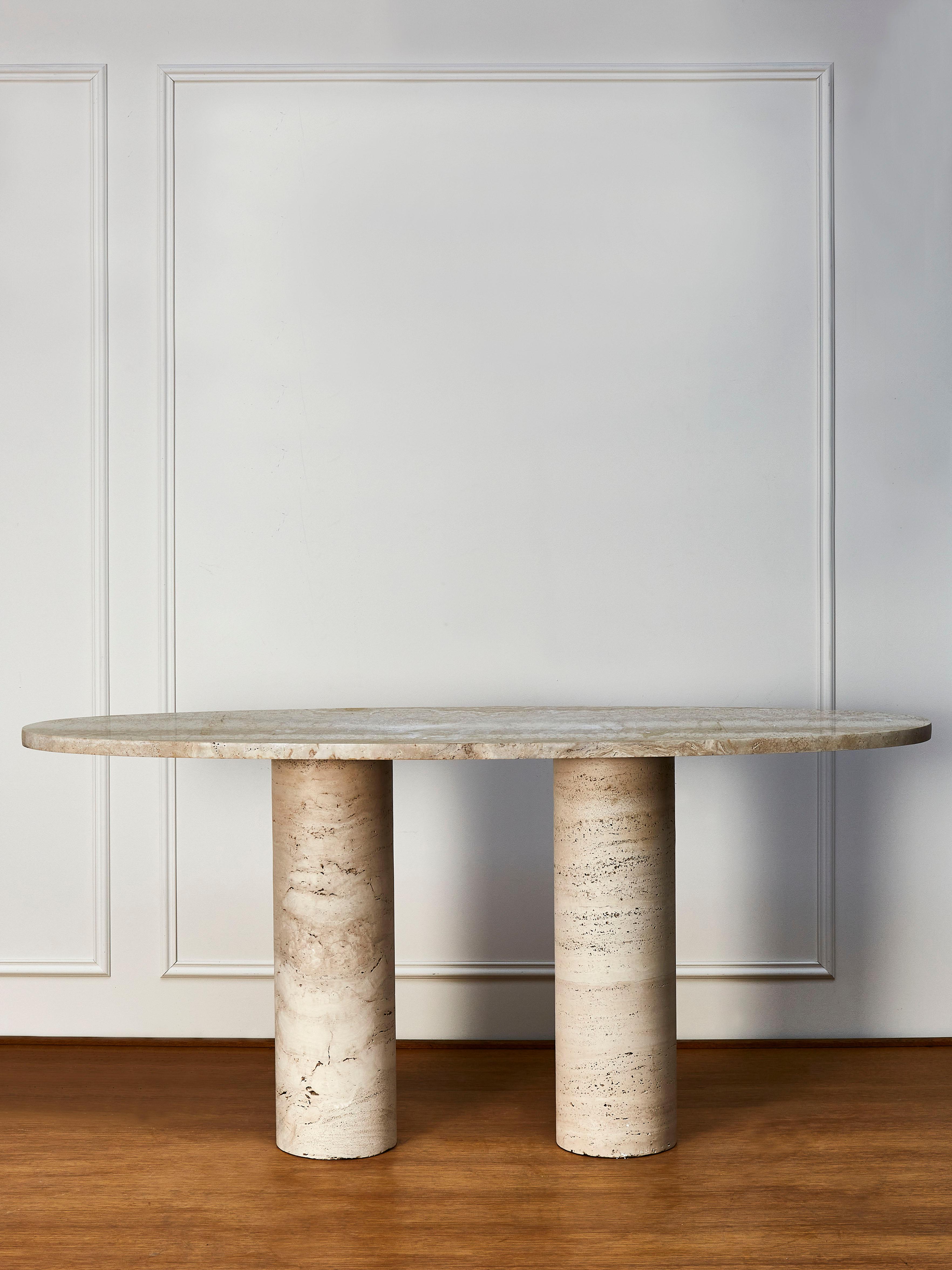 Beautiful console table made entirely made of massive travertine stone top, on 2 tubular feet also made of massive travertine stone. Creation by Studio Glustin.
  