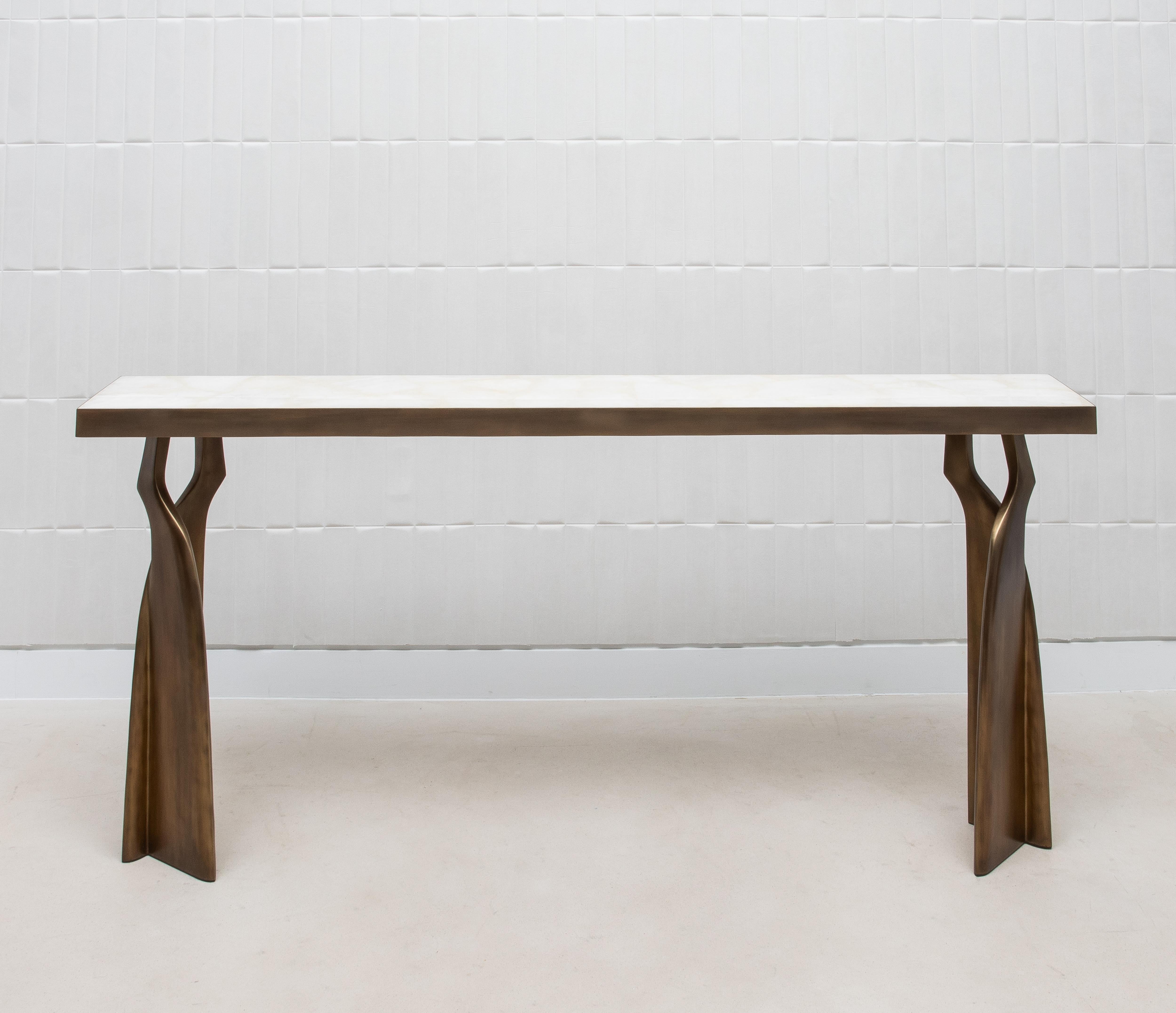 The Chital Console by Kifu Paris is a breathtaking embodiment of organic luxury, where natural beauty meets exceptional craftsmanship. The console's surface is a pristine slab of white quartz, whose ethereal translucence captures and reflects light,
