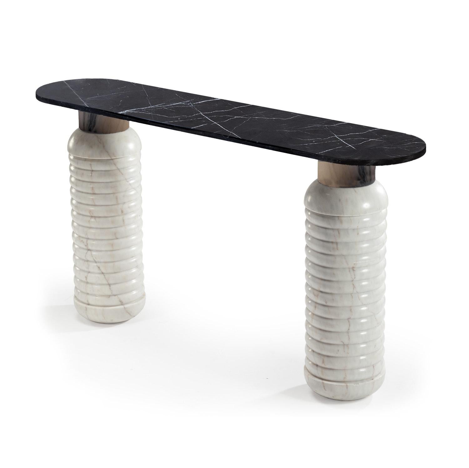 Jean console is unique in its conception. The combination of three different marbles makes it a sign of unconformity and originality. The combination in the picture is in Terrazzo top, Nero Marquina middle part and Estremoz White marble