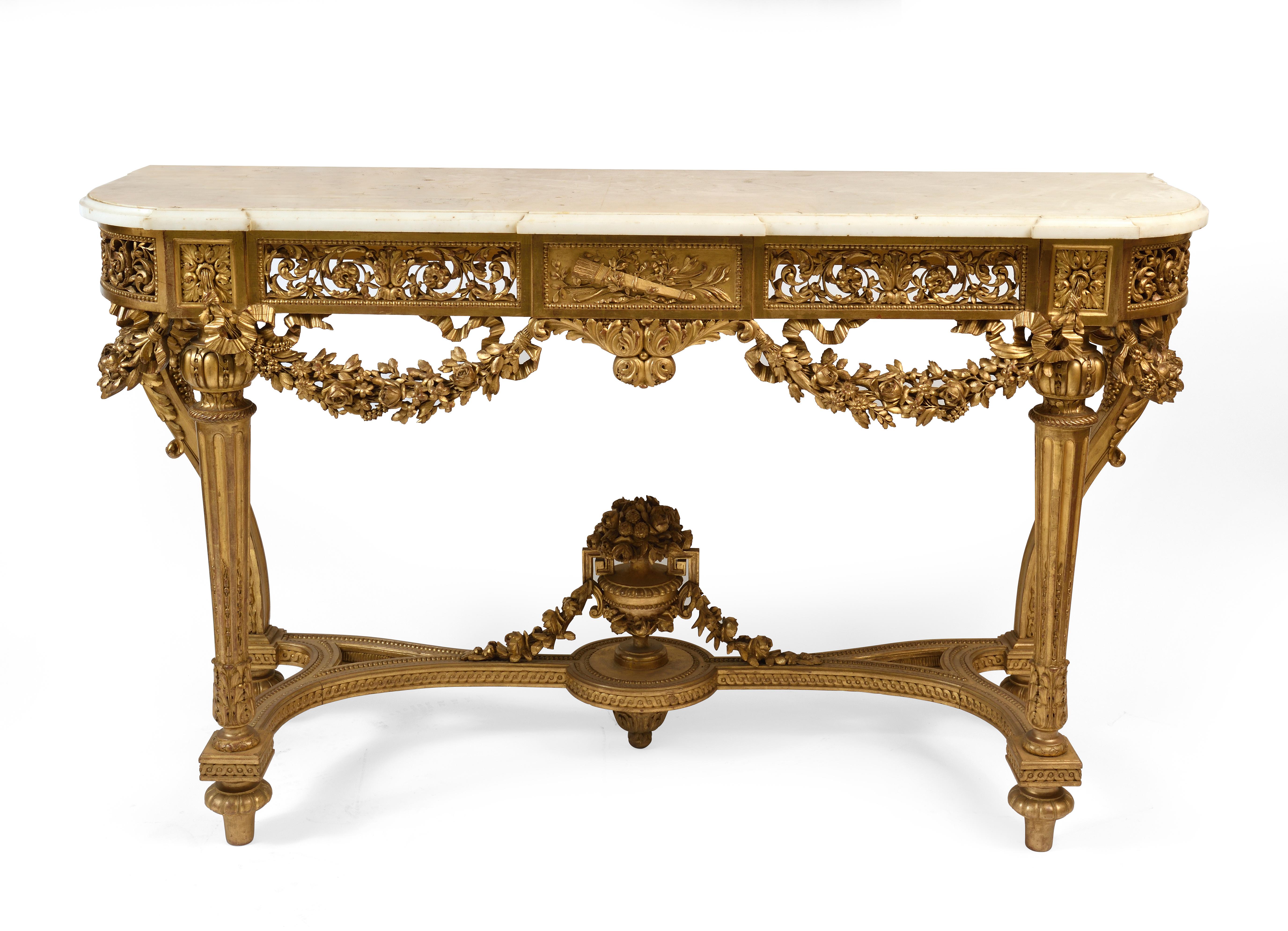 A high end french console giltwood of louis XVI style early 20th century
the white and grey marble top above a frieze carved with scrolling acanthus leaves and drapped with garland raised on four legs joined by a shaped stretcher
and a swag-draped