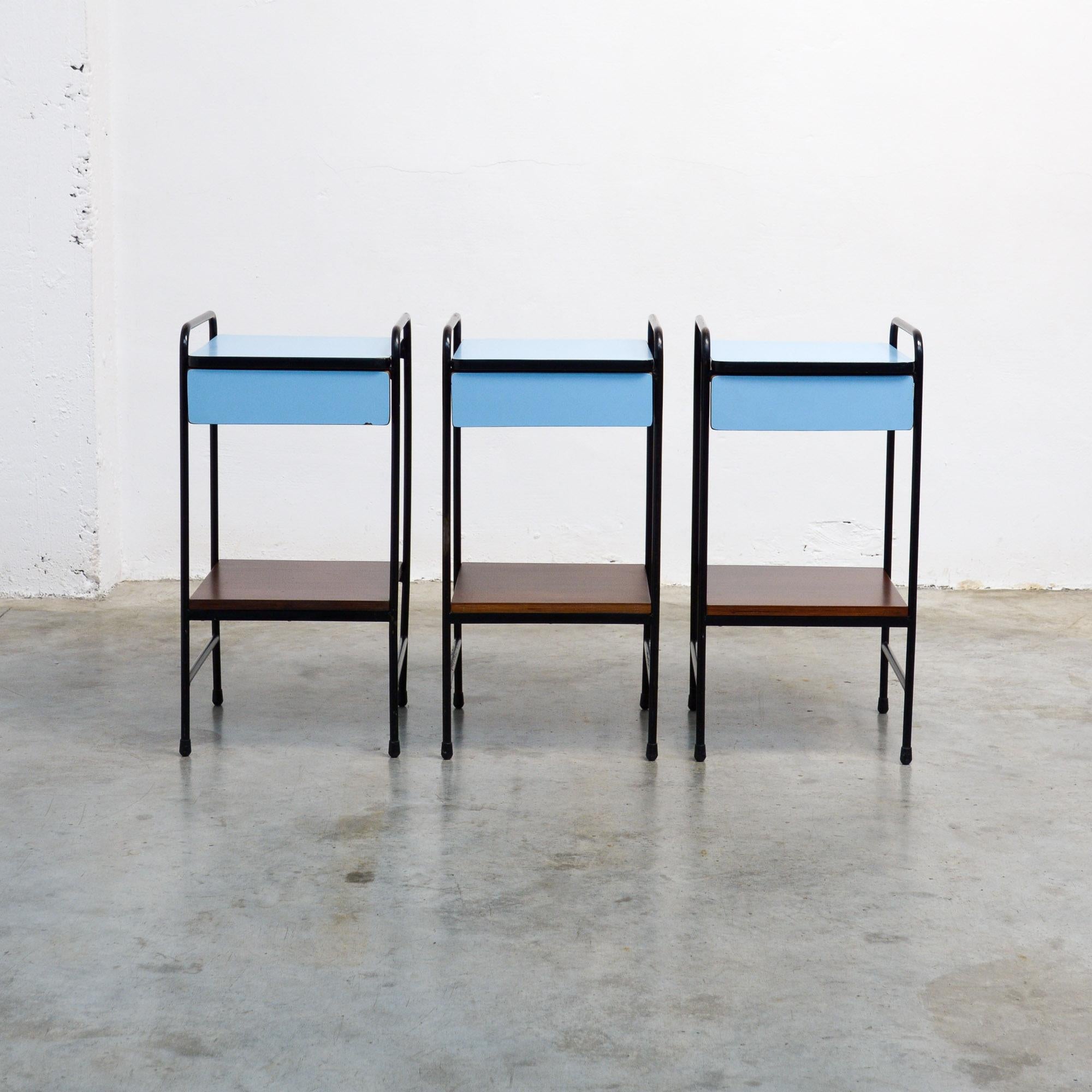 This unique console side table was probably designed by Willy Van Der Meeren and Eric Lemesre for Tubax in the 1950s.
The side table with the elegant black lacquered metal frame has a blue formica top, a metal drawer with the same blue formica