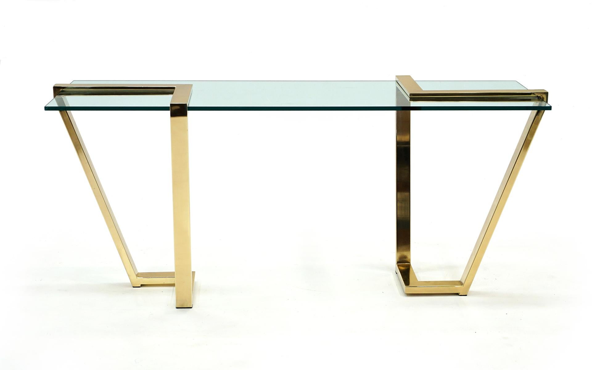Console / Sofa / Hall Table in brass and glass by Design Institute of America (DIA), 1970s. Striking design in which the original glass inserts into the brass frames with a screw on each that goes through the glass so it is secure in the frames. The