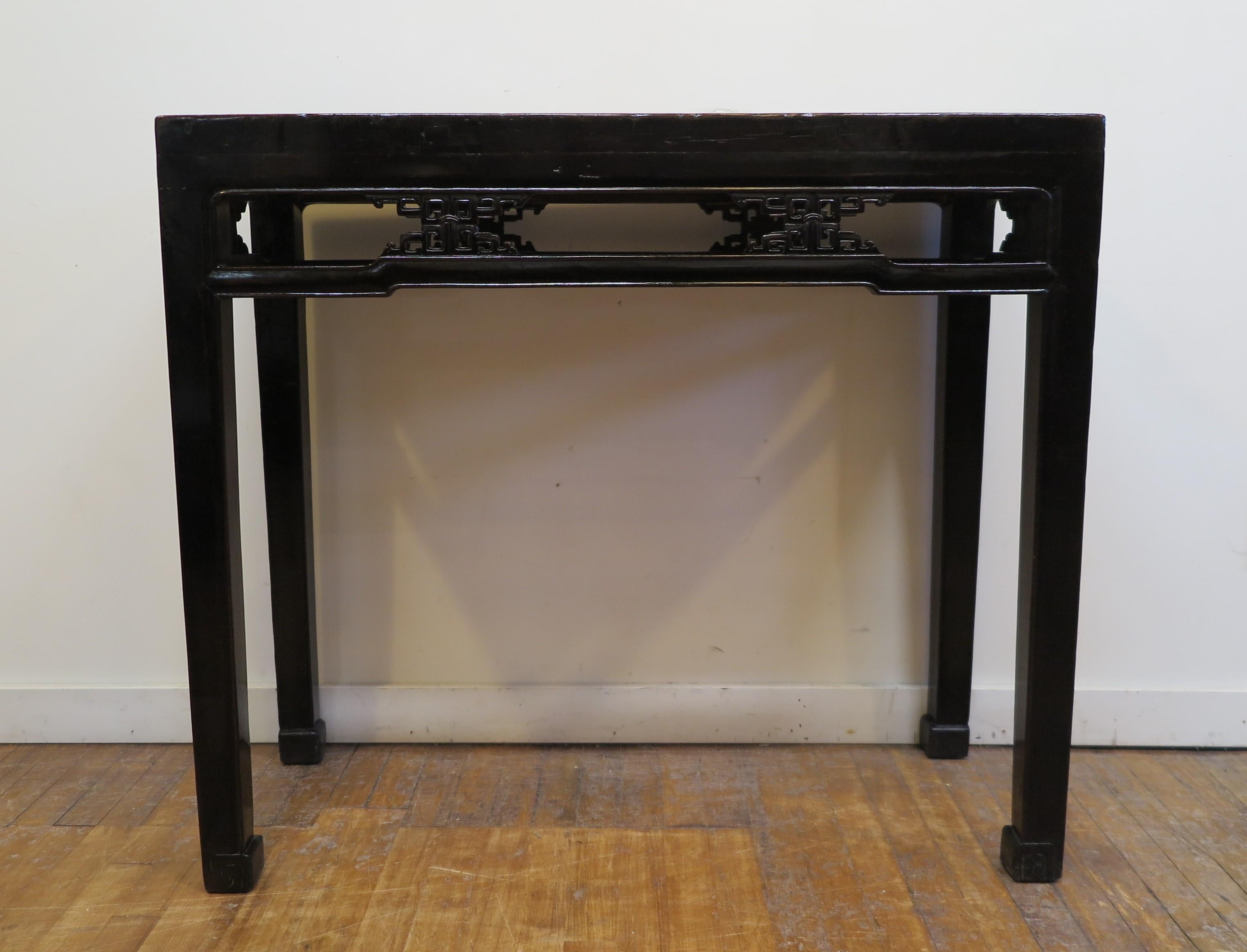 19th Century Black Lacquer Console Table. Qing Dynasty Console Table with humpback stretchers in original black lacquer. Solid Elm wood console table with auspicious double happiness carved motif detail set into the stretchers all the way around the