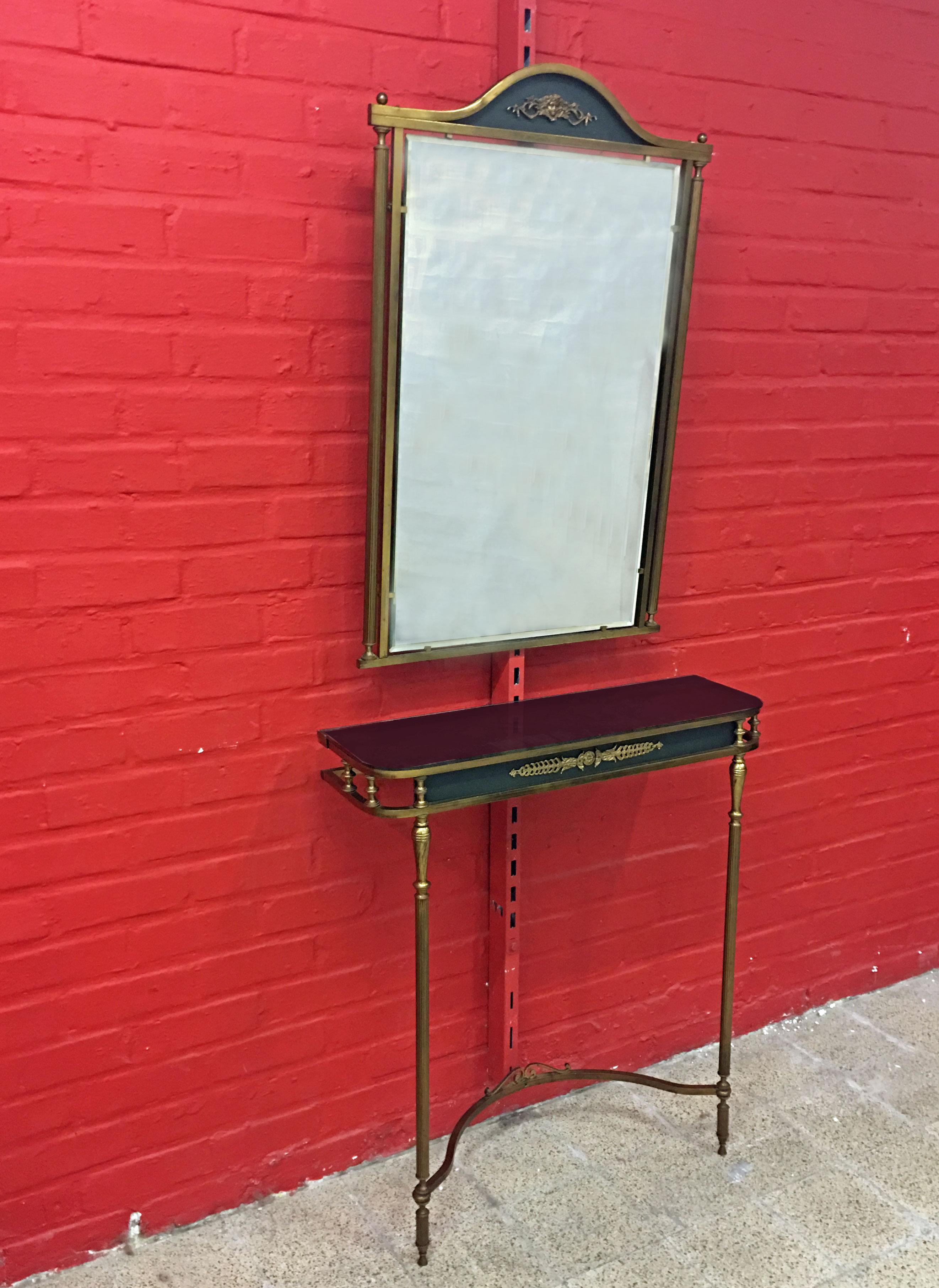 Console table and mirror in brass and lacquered metal, circa 1950-1960
Dimensions console H 95, W 75, D 23 cm
Dimensions mirror H 88, W 67, D 3 cm.