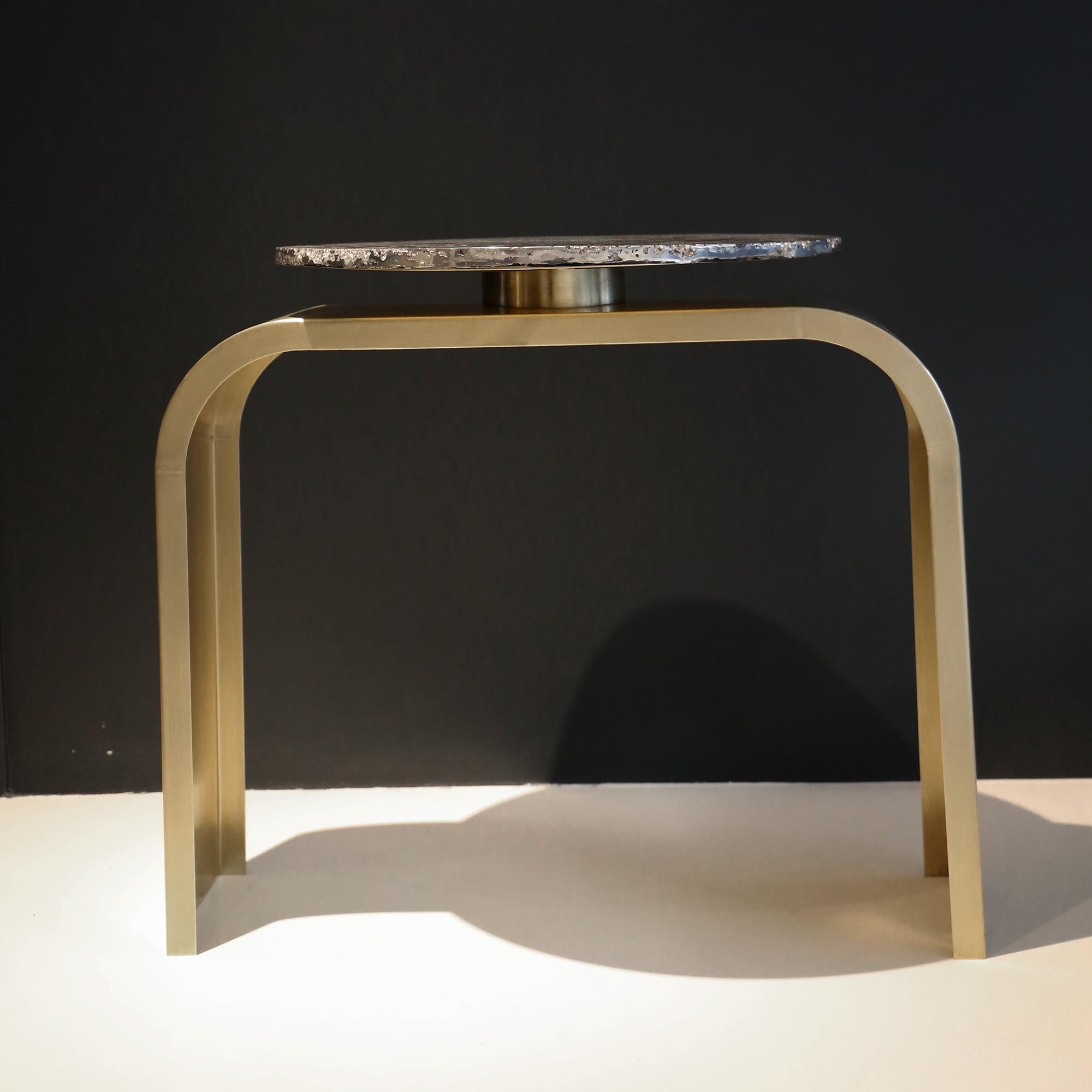 Made to order: This contemporary table is a unique piece, created by Xavier Lavergne and made of melted pewter with scales design, embedded in resin and polished like a marble. The table bronze legs are created in France and handmade in Africa with