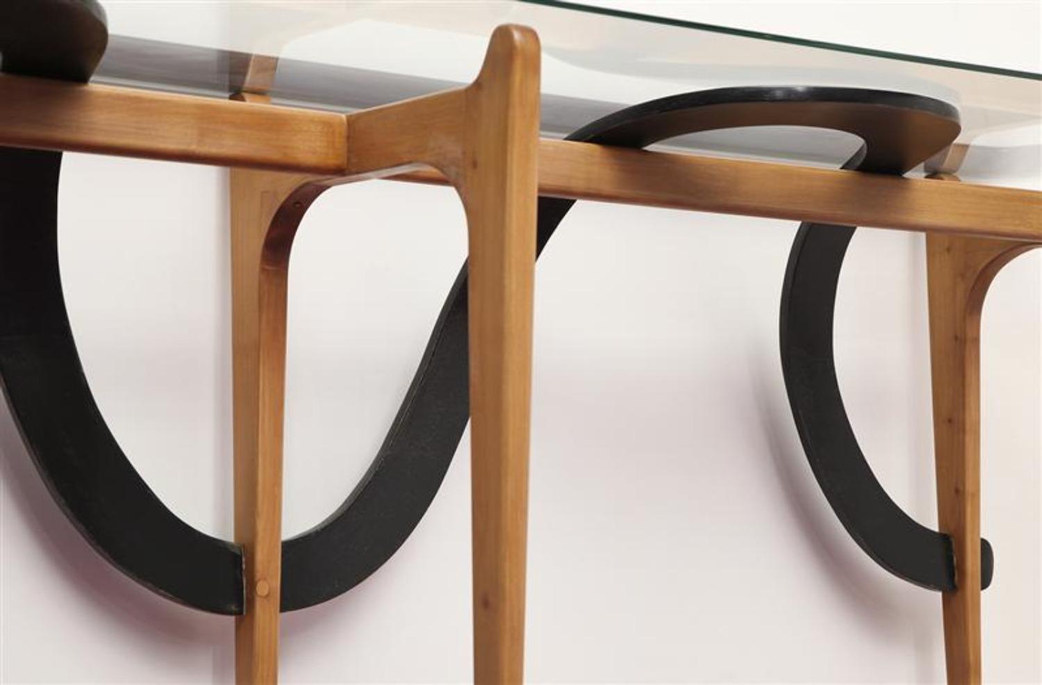 Rare Sculptural Console Table by Ico & Luisa Parisi
Italyc. 1954
Studio-built table. Architectural structure in ebonized & blonde woods. Glass top. A very rare double-wide version of a well documented console table.
