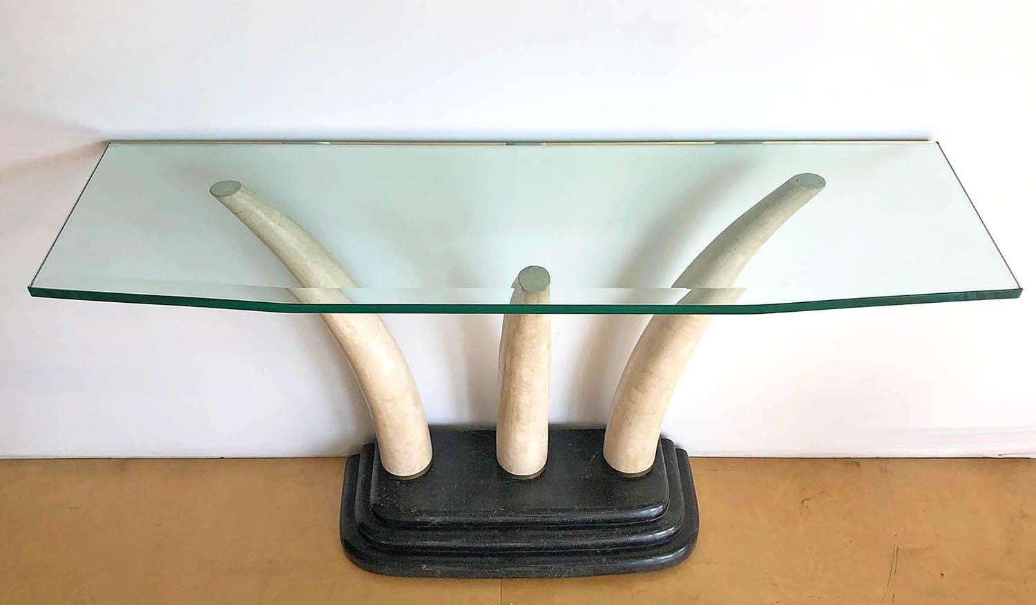 Stone and beveled glass console table by Maitland. Tusks are made from tessellated stone. Not sourced from animals. Finest quality materials and craftsmanship.

Complementary delivery in the Los Angeles / Beverly Hills area. Pick up is also an