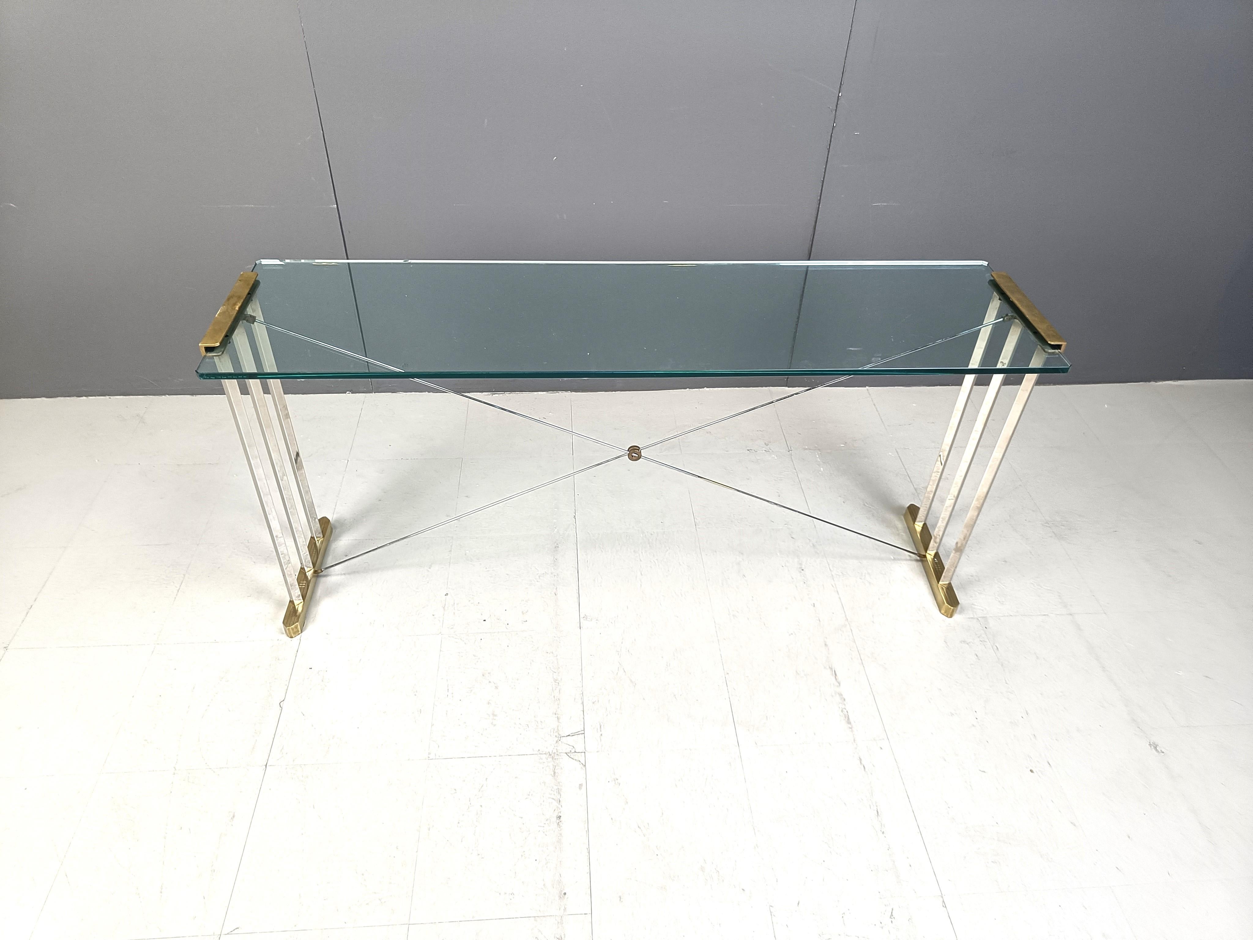 Rare brass console table designed by Peter Ghyczy.

Ghyczy is known for his bronze/brass tables with integrating the glass in the design as subtile as possible.

Timeless design. 

Good condition

1970s - Netherlands

Dimensions:
Height: 70cm
Width: