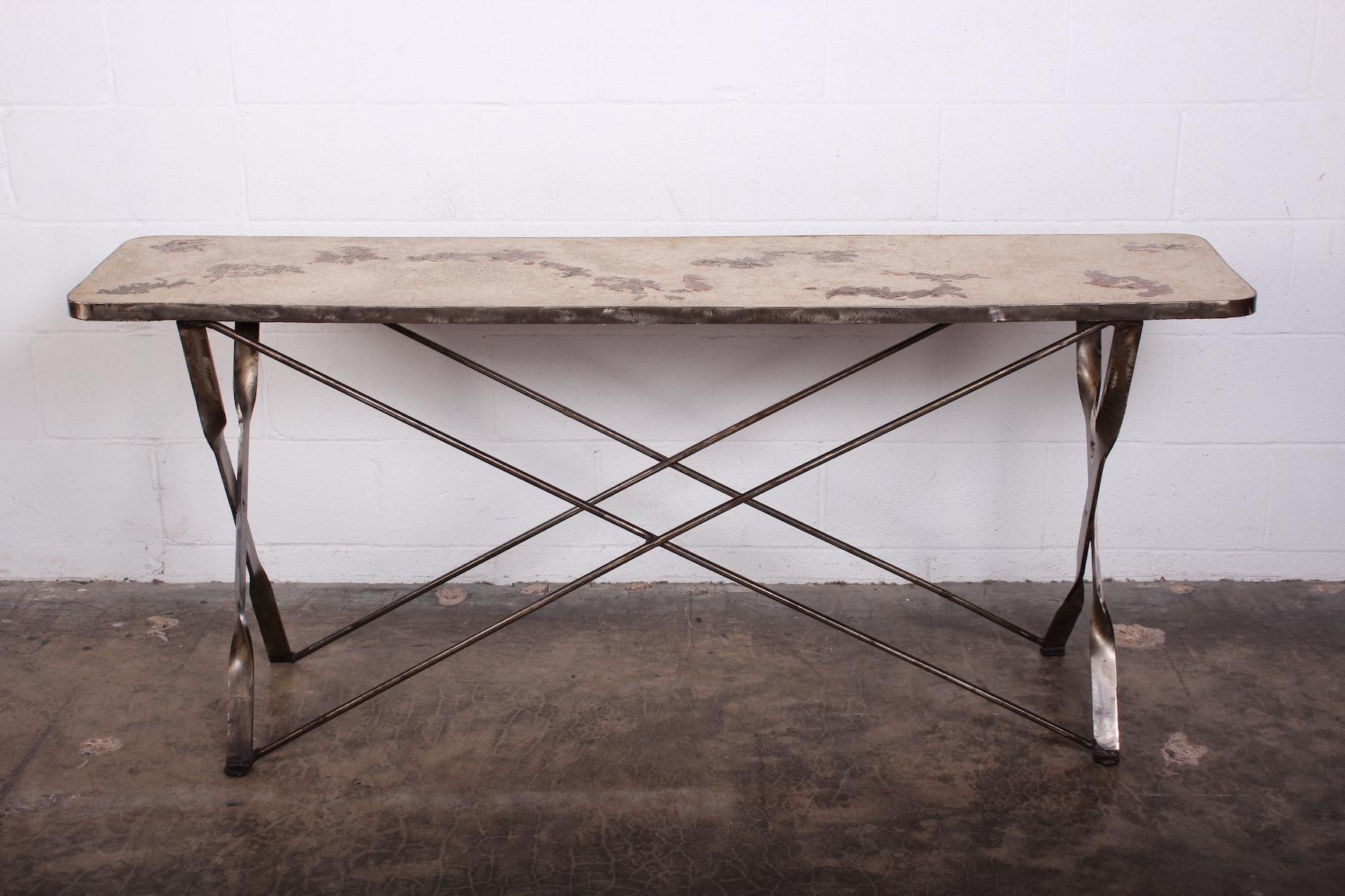 A Silas Seandel console table with steel base. Concrete top with inset brass and copper.