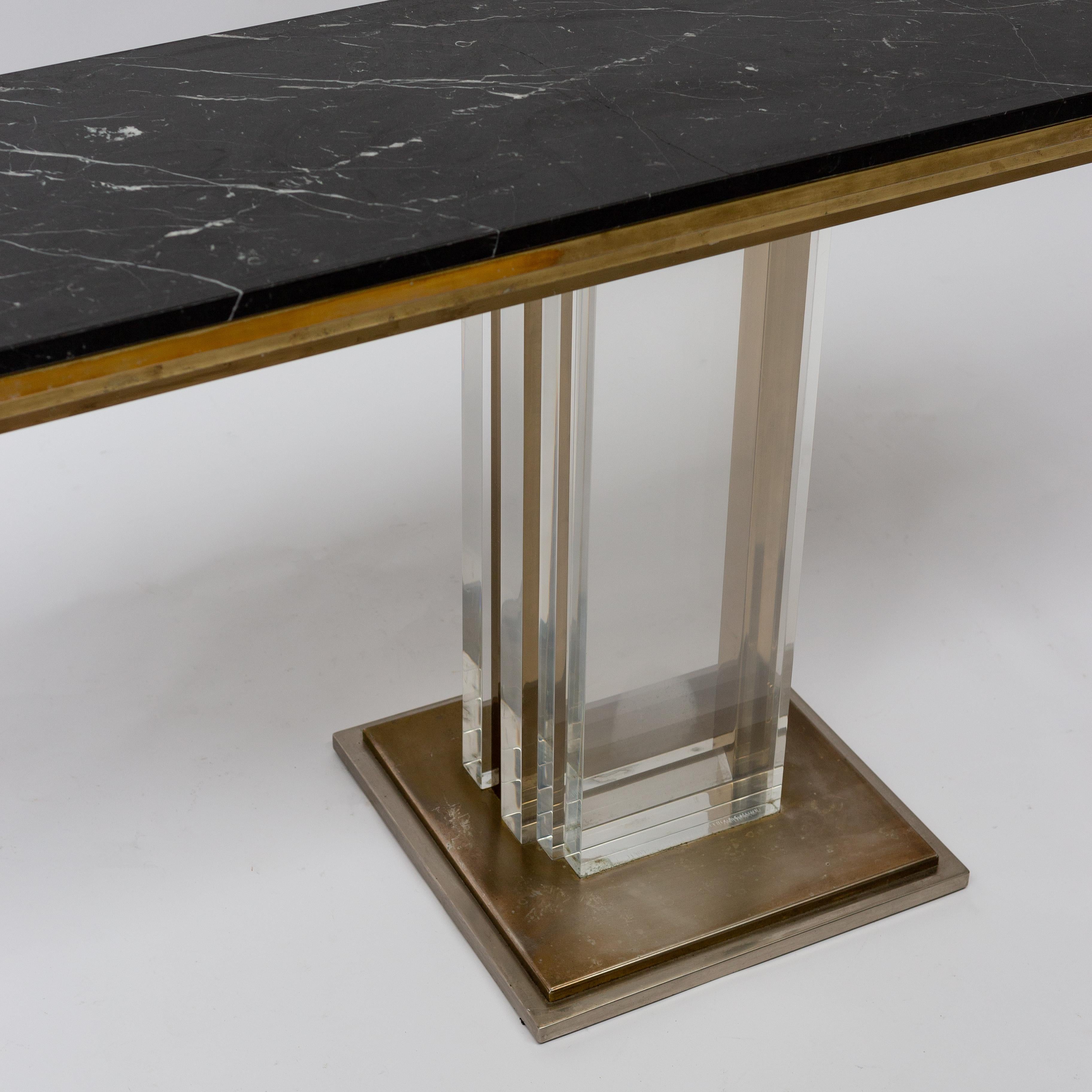 Stunning console table full brass and chrome metal, tick black marble top, by Willy Rizzo. 
Rare manufacturing plexiglass model.