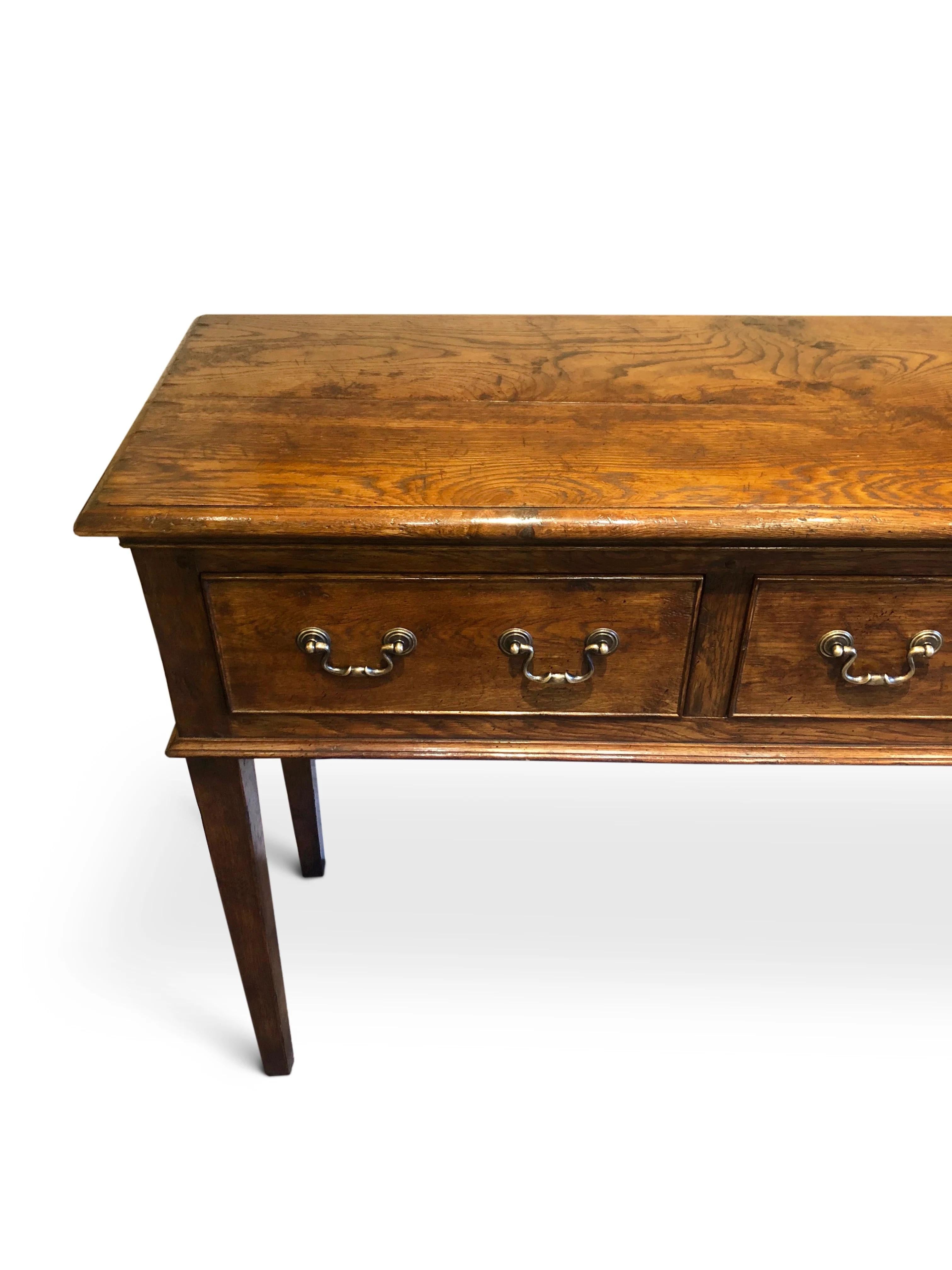 Dresser Base style. Sideboard or Console Table
Three Drawer Hall Table made. by Garners in Oak with a semi rustic Dark Walnut finish.
This Sideboard looks in period & feels authentic.

Available in high polished finish or in a plain country rustic