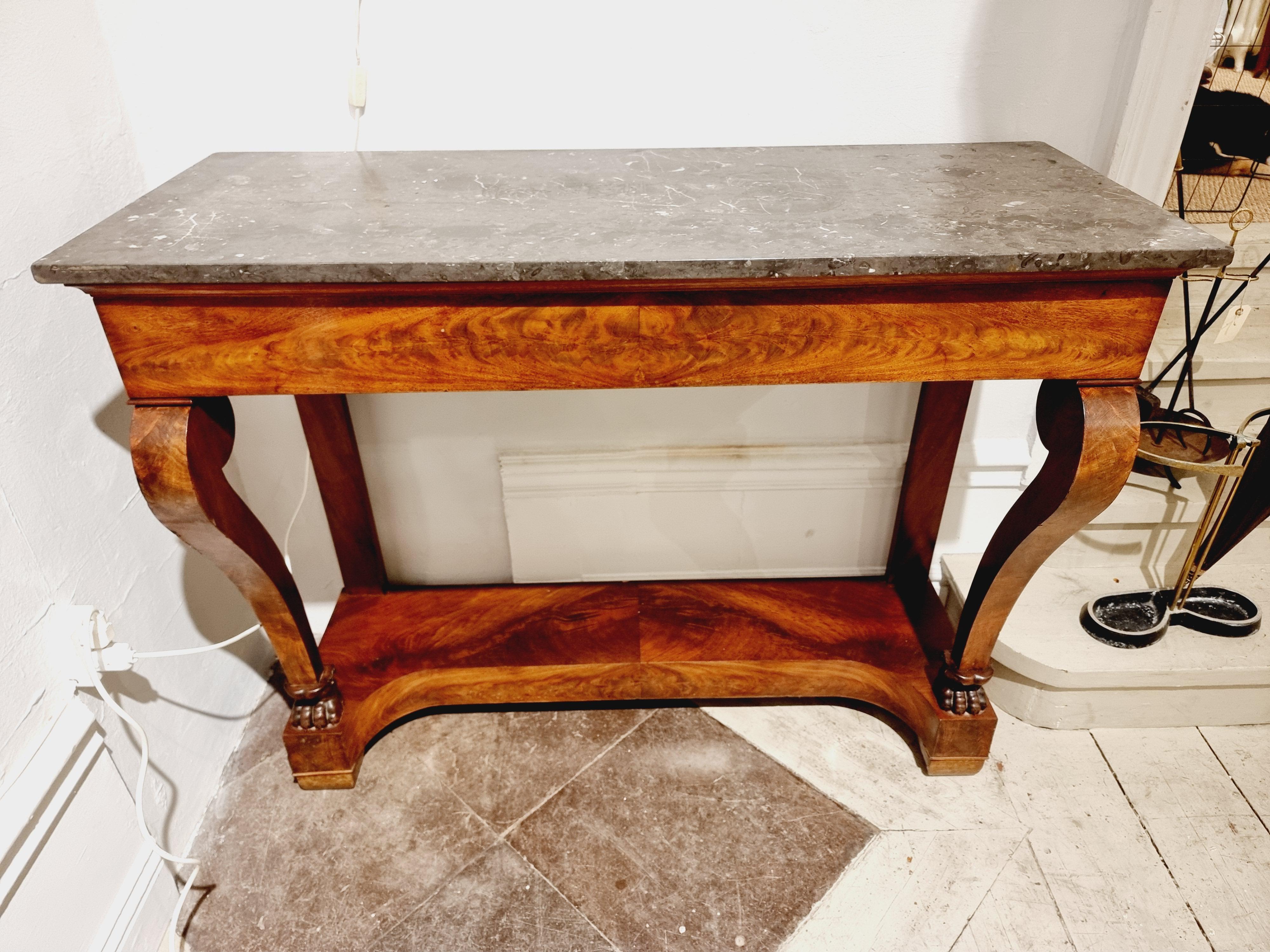French empire console table with Saint Anne des Pyrenees Marble, a grey marble quarried in France. Wood veneer, beautiful curves and legs with decorative lion paws. An antique timeless beauty that works with most interior styles. 

In beautiful