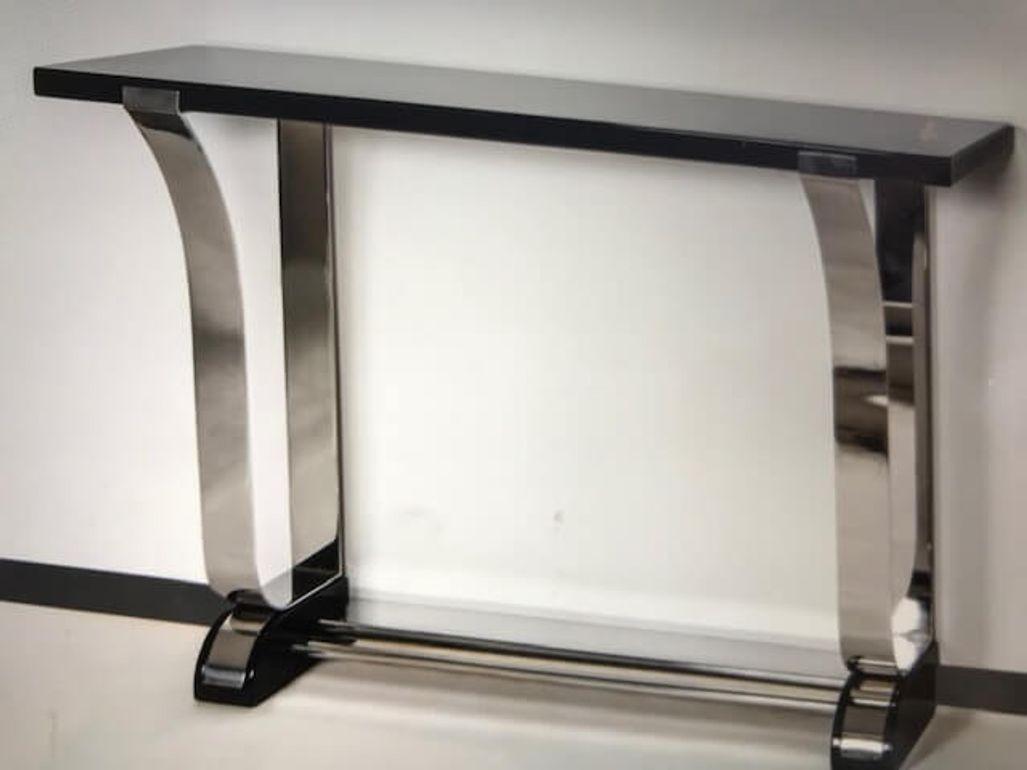 Beautiful Art Deco style console table in stainless steel and Piano Lacquer
According to the original plans, an Art Deco console by Gunther Sachs in southern Germany
Black piano lacquer on wood. Curved and polished stainless steel frame (5 mm thick