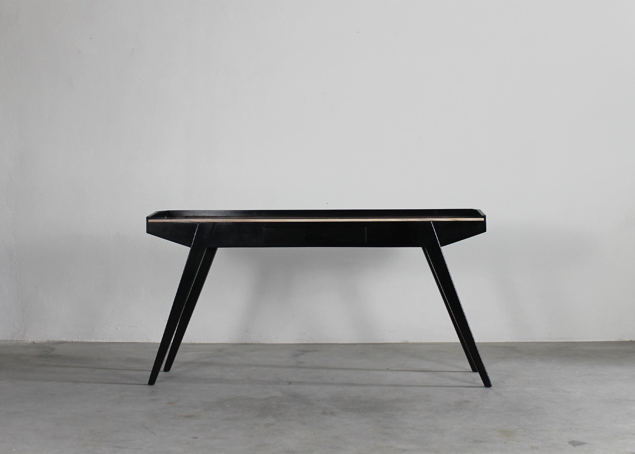 A Mid-Century Modern style console table with a structure in black lacquered wood and a tabletop in pink marble. 

The console table presents a single drawer on the frontal part.

Italian manufacture from the 1950s.