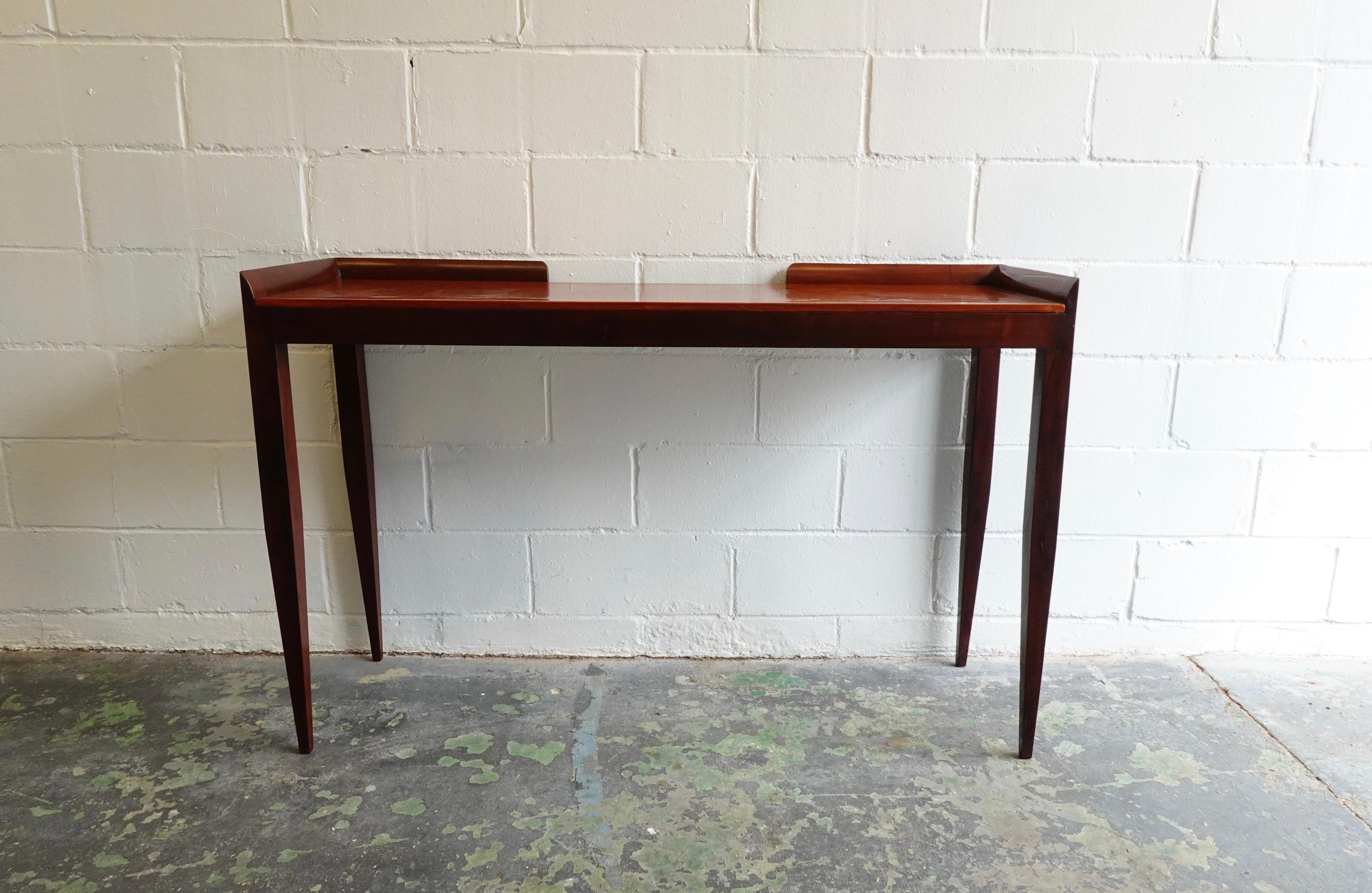 Elegant wall console in Italian walnut with lacquer finish over gesso ground top. Lovely hand shaped gallery, great proportions, timeless beauty.