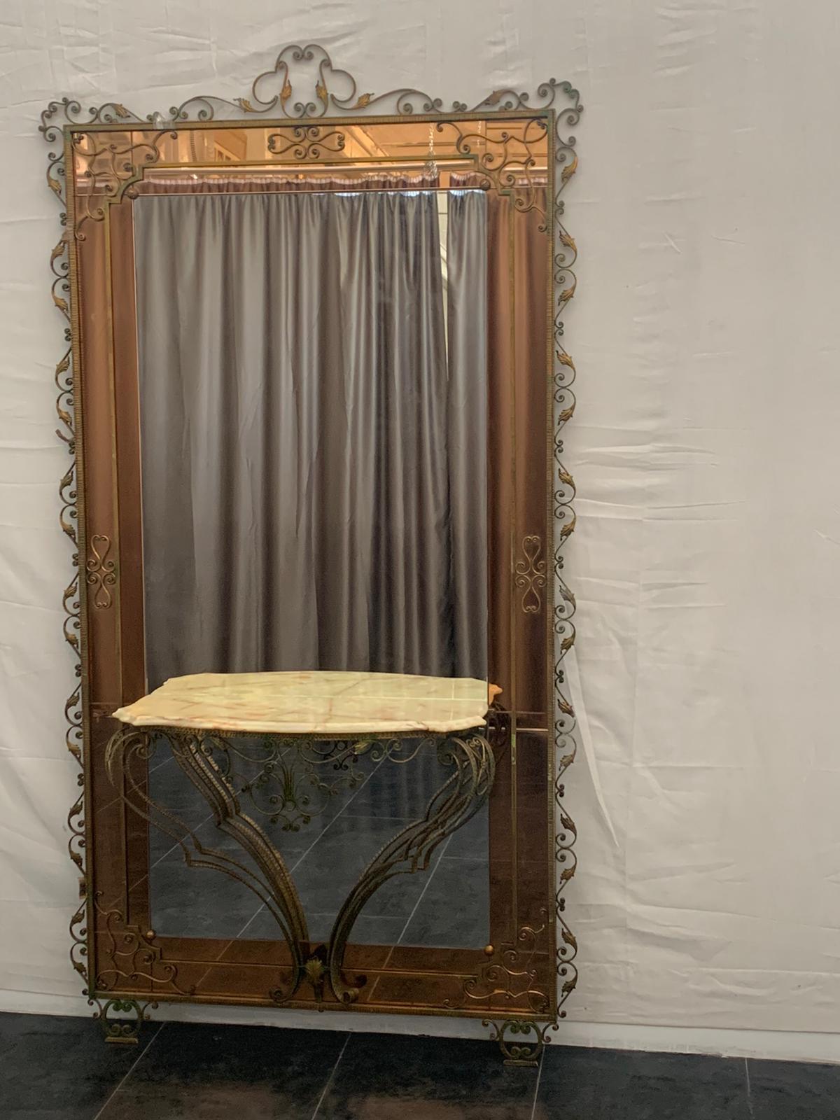 Wrought iron console table with mirrored back by Pierluigi Colli, 1950s.
Packaging with bubble wrap and cardboard boxes is included. If the wooden packaging is needed (fumigated crates or boxes) for US and International Shipping, it's required a